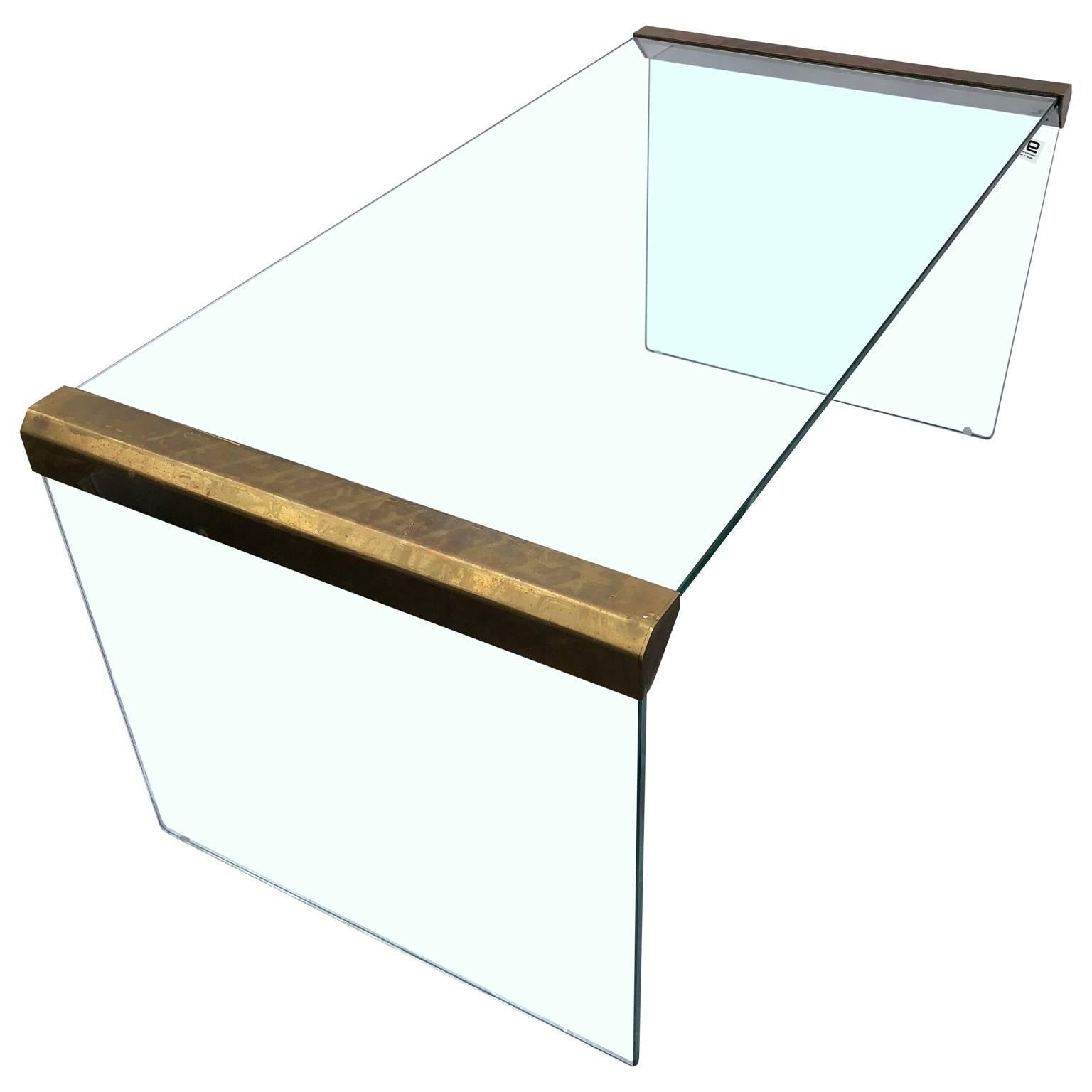Small Italian Mid-Century Modern glass and brass cocktail or coffee table by Pierangelo Galotti and Luigi Radice, of Galotti & Radice, Cermenate, Italy.
The brass hardware's 3rd side panel, underneath is chromed, see detailed image no 5.

$125