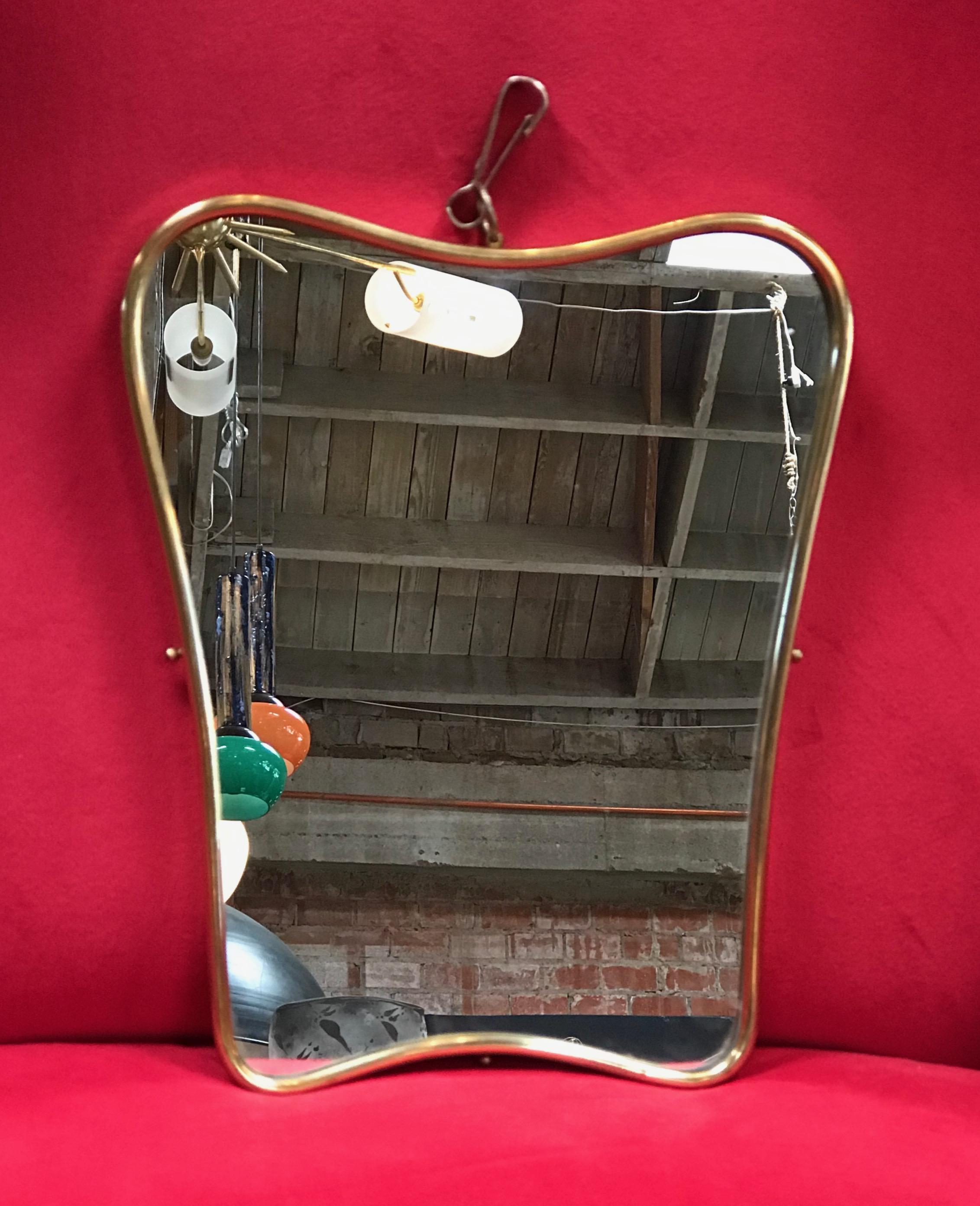 Small Italian minimal curvilinear brass mirror, 1950s.