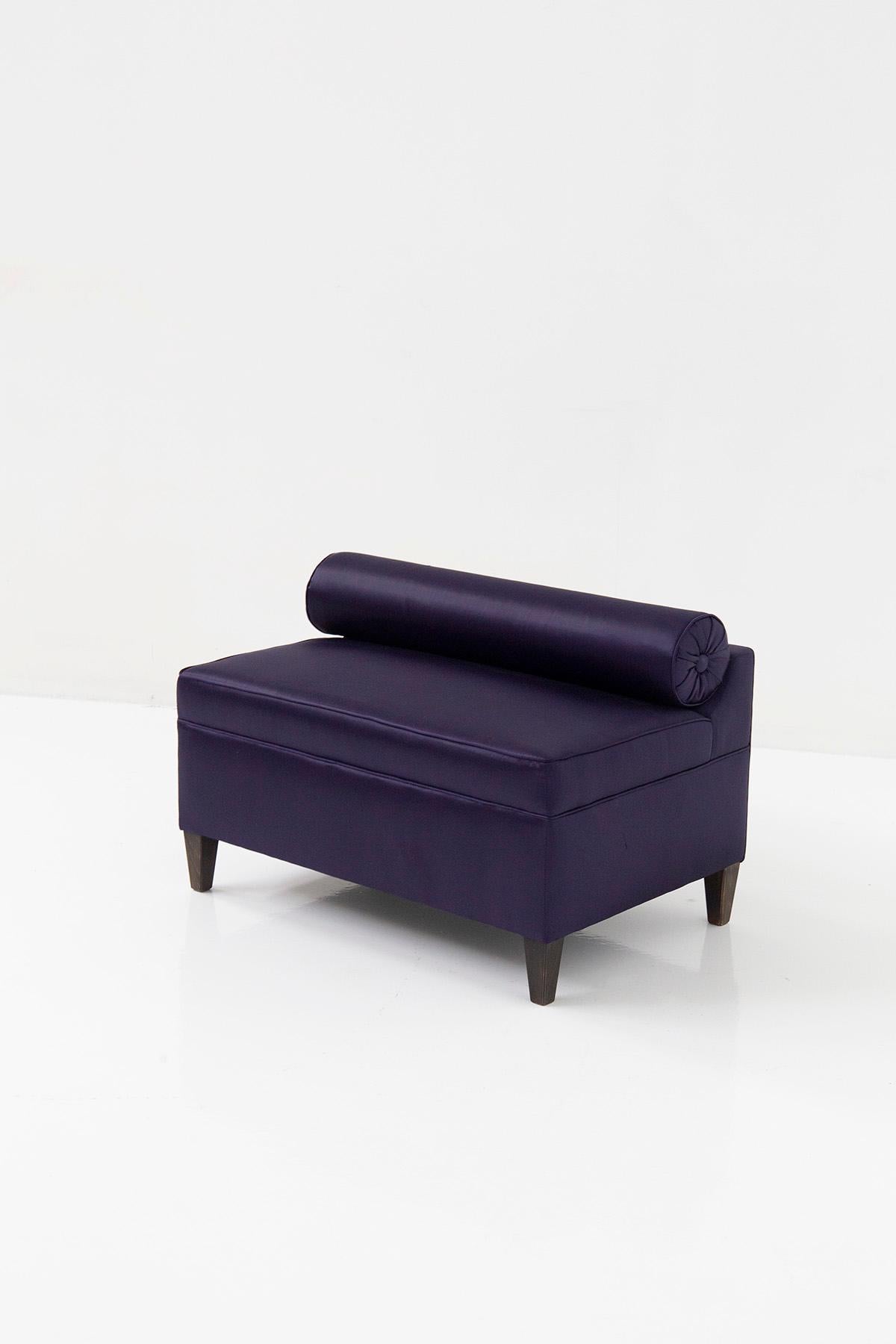 Introducing an elegant 20th-century Italian bench or settee, entirely crafted with purple satin fabric. This exquisite piece exudes elegance and is ideal for furnishing quirky living rooms with a classic and glamorous style. By adding this sofa to