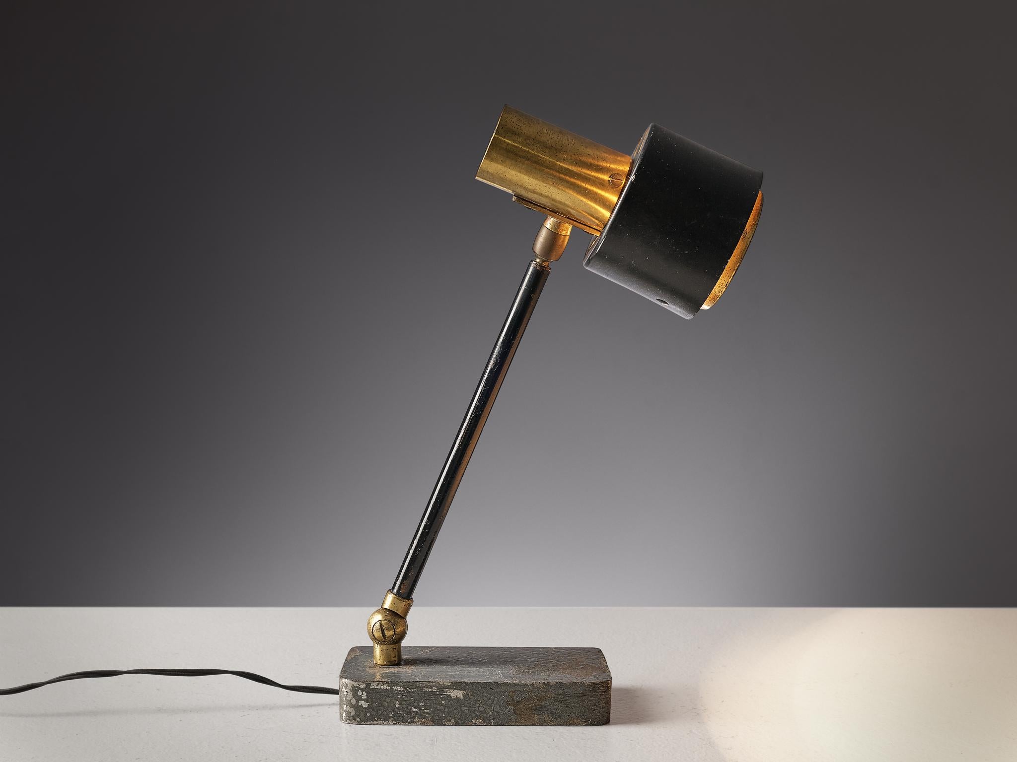 Table lamp, brass, aluminum, metal, Italy, 1960s.

This table desk lamp is stunningly executed in brass and metal. It features a simple but elegant shades consisting of brass and a black aluminum. The base of this is a rectangular shape made out
