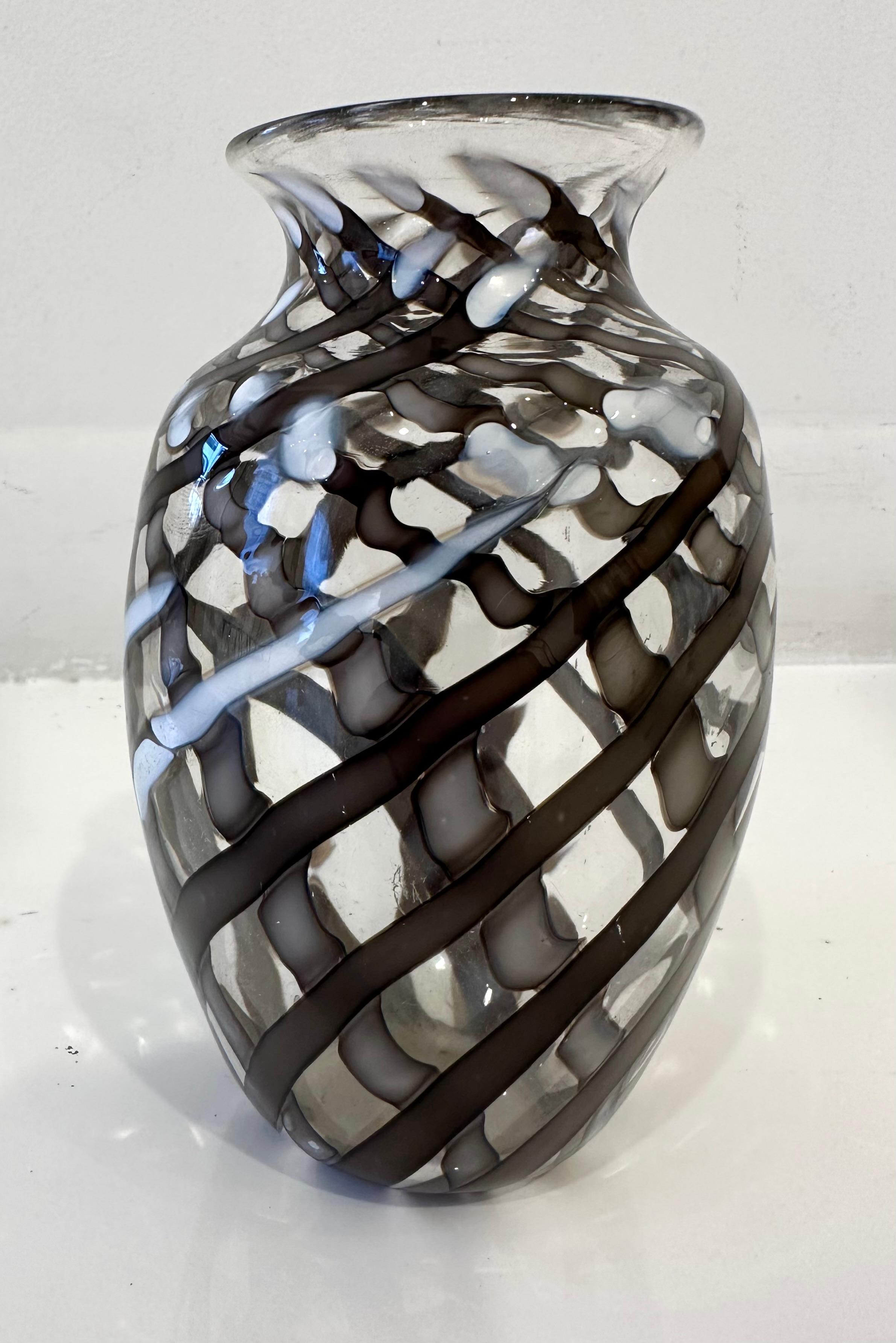 A small vase with opaque black and white striping, by Barovier.