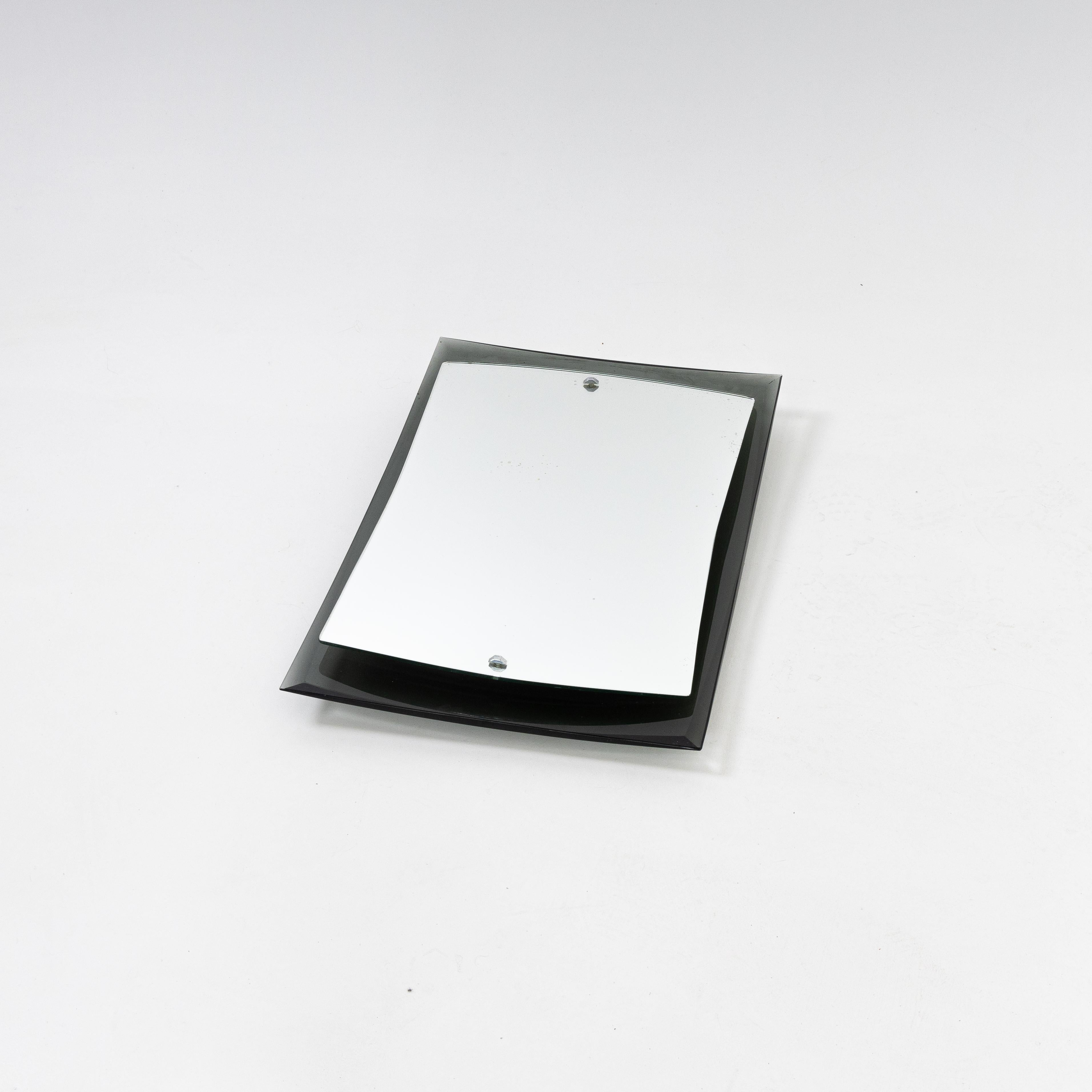 Small Italian Modernist mirror.
Curved smoked glass back 
with floating mirror mounted on top.

 