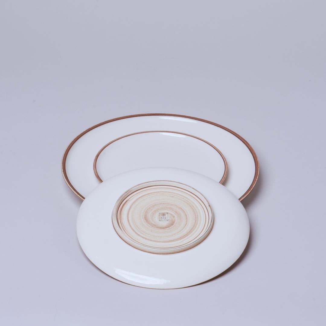Middle Kingdom Hermit plates are inspired by traditional wares that were fired rim down. This firing style saved kiln space and obviated the need for saggars (firing boxes). The humble style of these bowls is now celebrated as contemporary design in