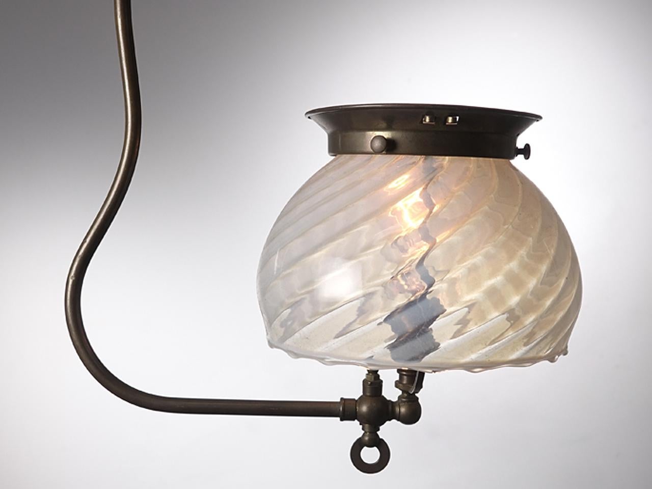 The hand blown 7.5 inch shade on this lamp is just beautiful. The fixture is a simple 1890s gas style that is newly wired to take a single candelabra bulb.