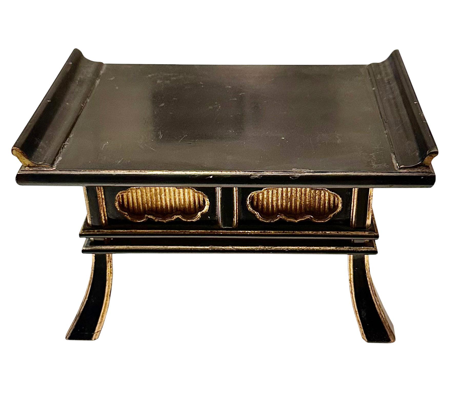 A turn of the century small Japanese black lacquer and gold gilt alter table with flared legs. in very good condition for the age and even the bottom is trimmed with gold.