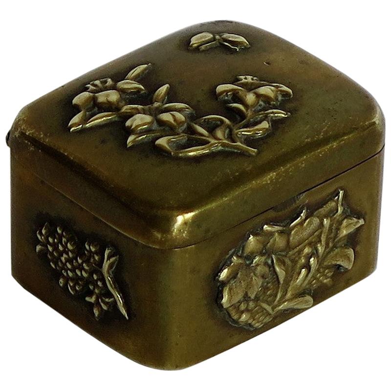 Small Japanese bronze and brass embossed Box with hinged lid 19th C Meiji Period