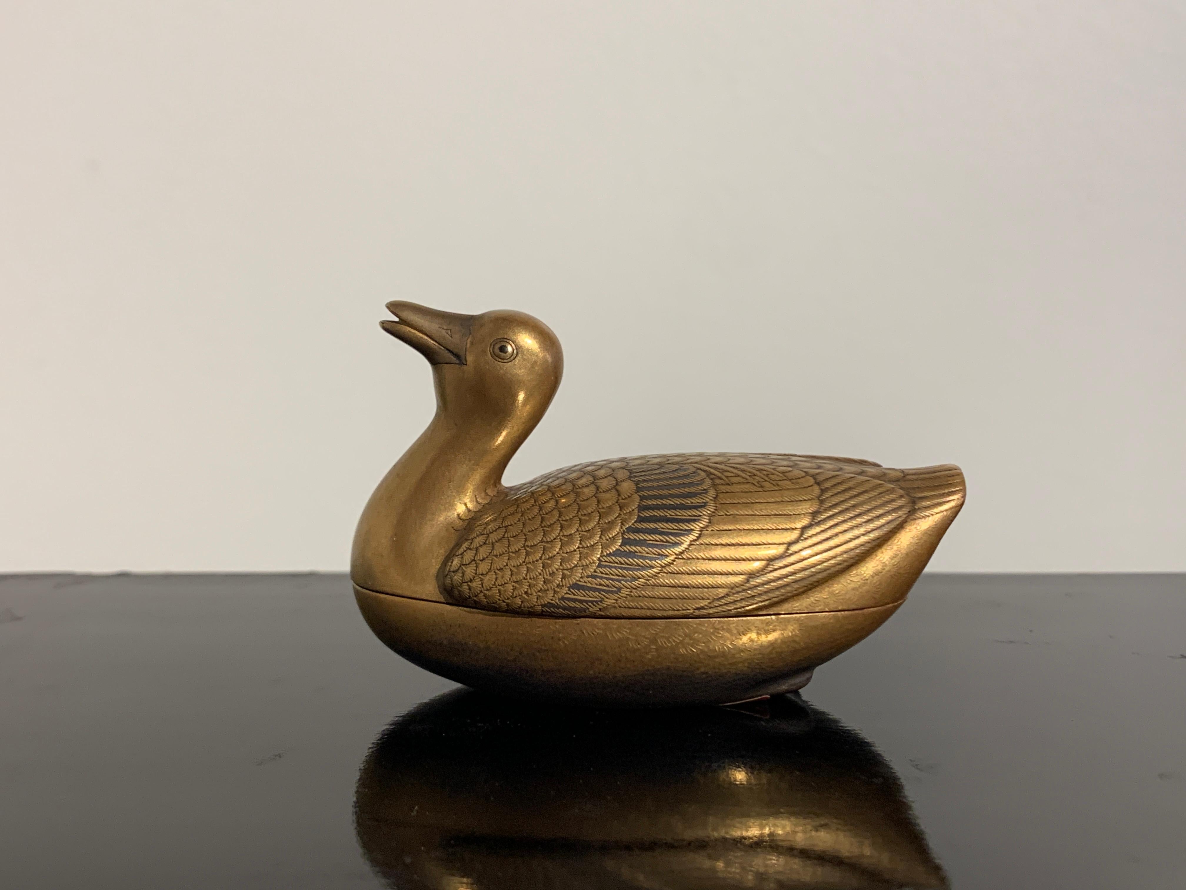 An exquisite Japanese Meiji Period small lacquer incense box, kogo, in the form of a duck or goose, late 19th century, Japan.

The delicate lacquer box, known as a kogo in Japanese, was originally used to hold precious incense. 
Finely crafted out