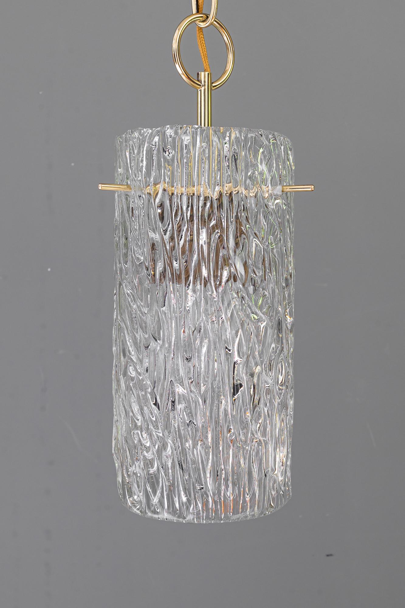 Small Kalmar pendant with structure glass around 1950s
Brass polished and stove enameled
