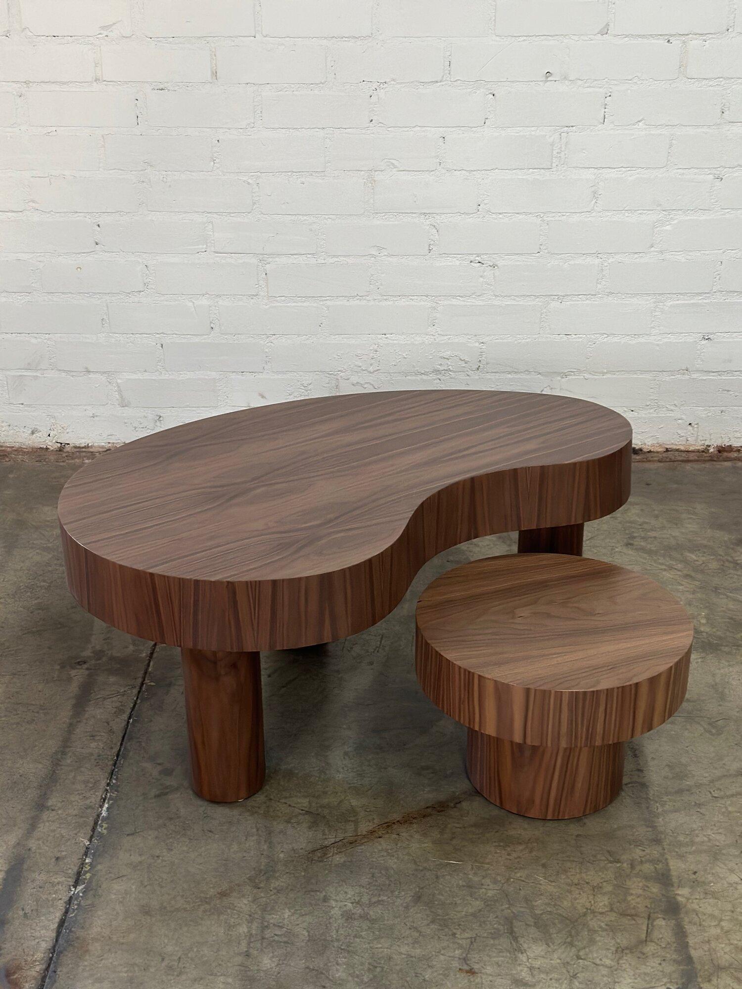 W43 D26 D13.5 H18

Nesting table W17.5 H12.5

Handcrafted Kidney coffee table made in house by Vintage On Point. Made in solid wood framing and veneered in walnut. Small side table can be pushed underneath larger table or pulled out as desired for