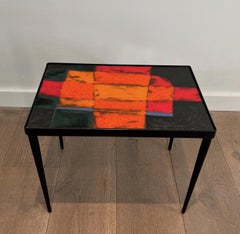 Small lacquered metal and ceramic side table. French work. Circa 1950