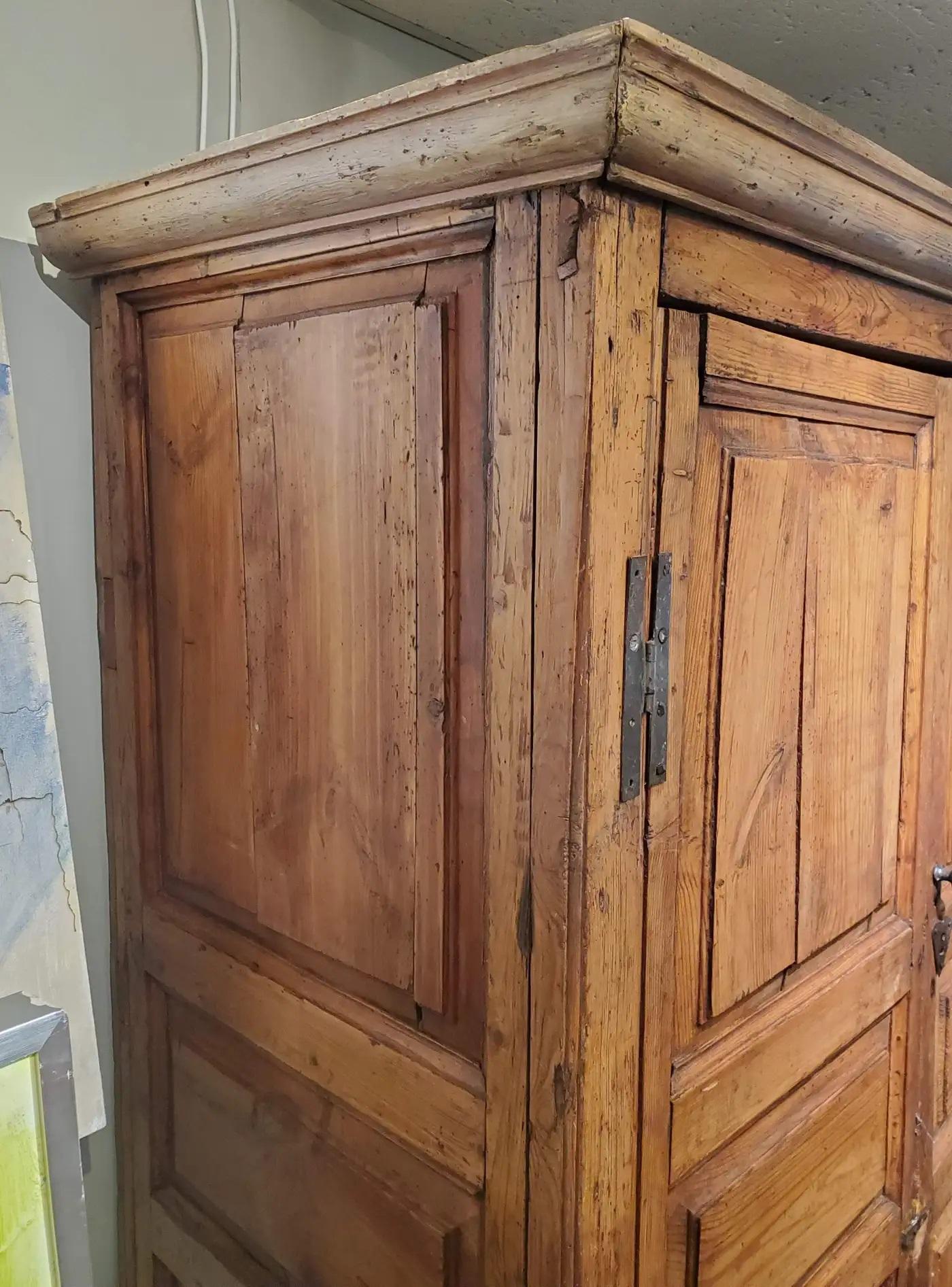 A charming and well-proportioned late 18th-century pine cabinet from County Cork, Ireland, dating to circa 1780. This handcrafted piece is a beautiful example of vernacular Irish furniture from the southern provinces, notable for its restrained