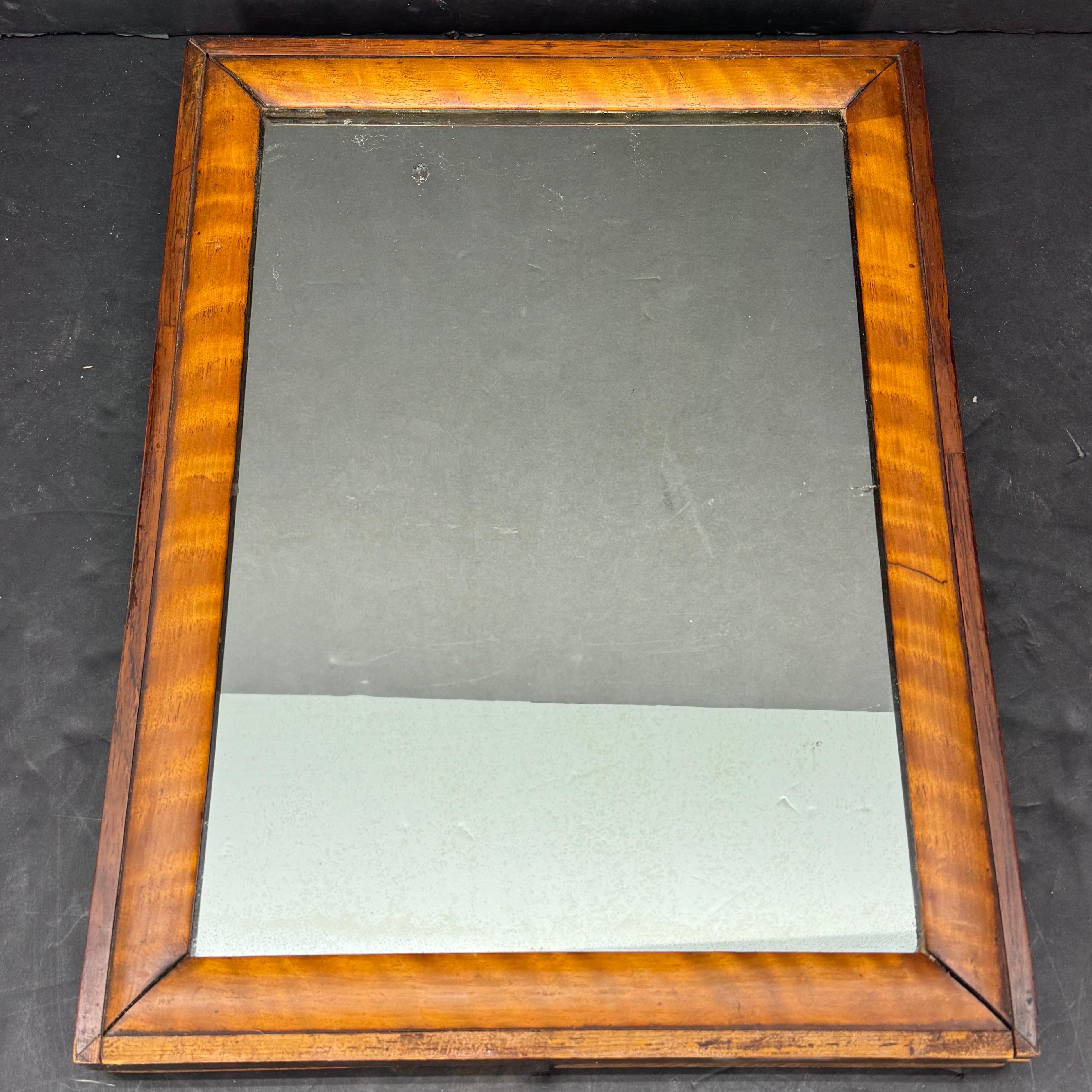 English Mahogany Table or Wall Mirror, circa 1860-1900. This small rectangular veneered mirror can either stand on a table or hang on a wall.