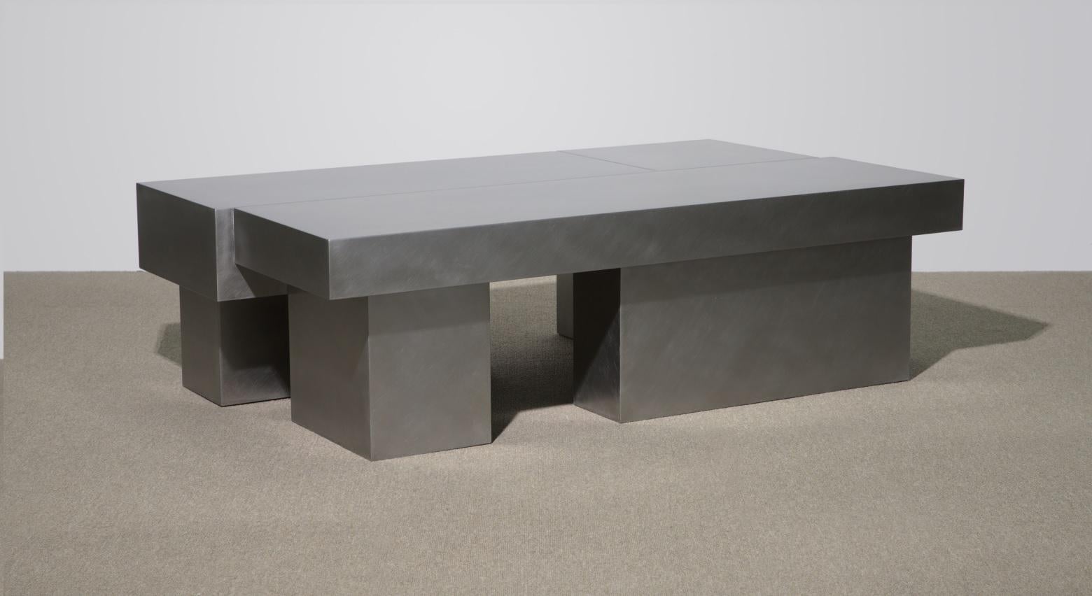 Small Layered steel coffee table I by Hyungshin Hwang
Dimensions: D 120 x W 72 x H 36 cm
Materials: stainless steel

Layered Series is the main theme and concept of work of Hwang, who continues his experiment which is based on architectural