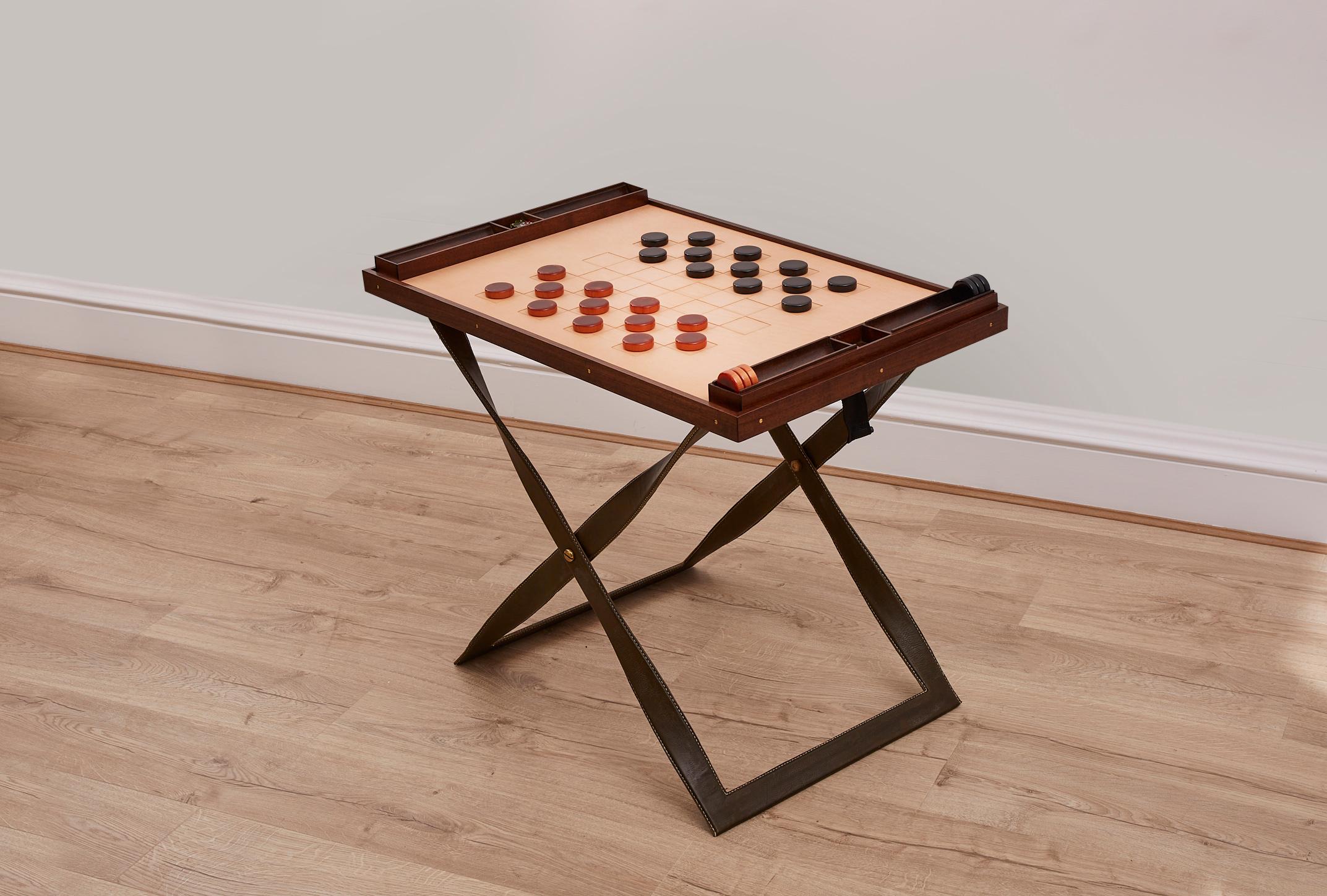 Made to order, these Games tables are of extremely high quality: bespoke made in England, the beautiful walnut and leather finish makes for a sophisticated games experience. reversible top allows for checkers, Chess or backgammon board. The perfect