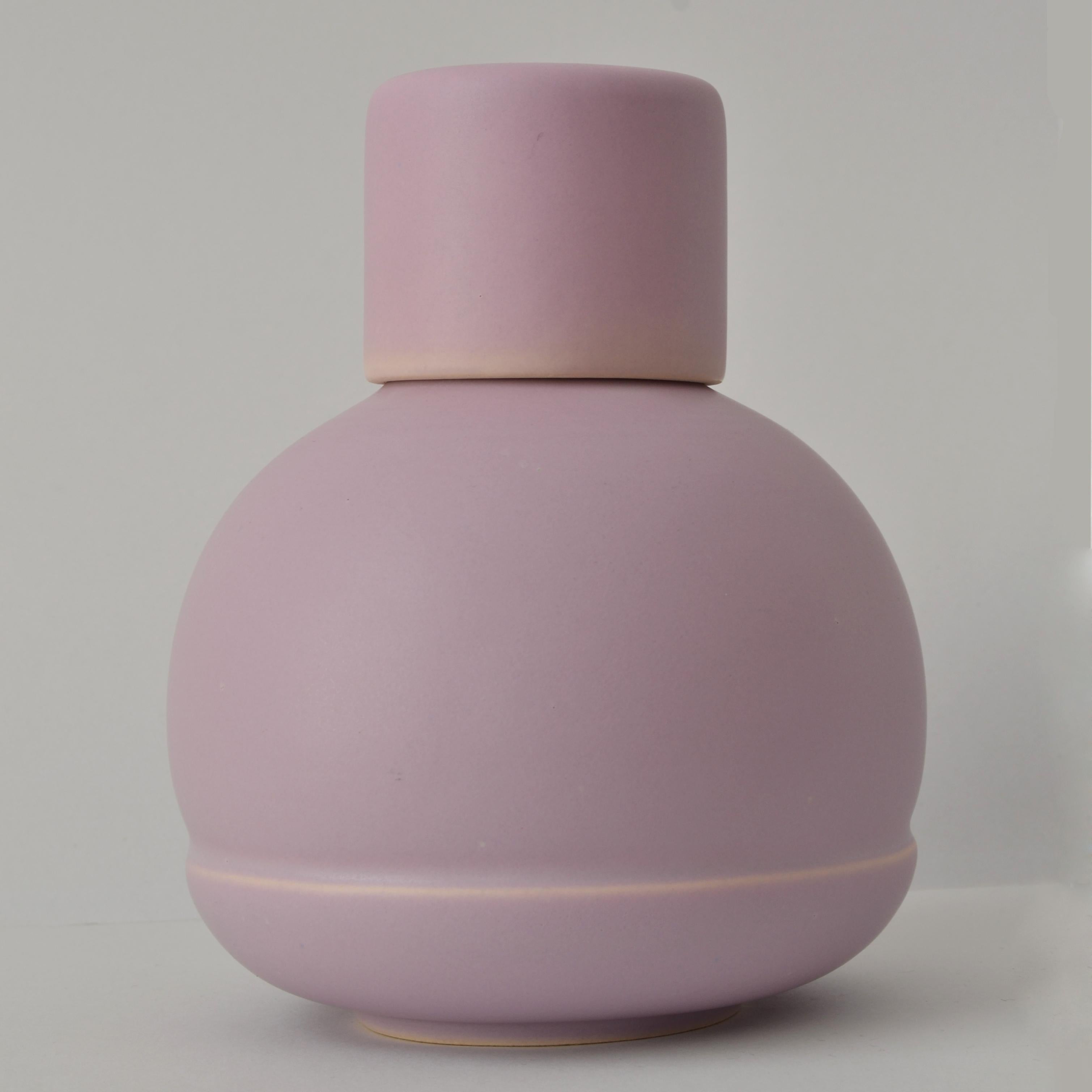 Small lilac bottle by Omar Ortiz, 2021
Dimensions: H13 x W15cm
Materials: High Temperature Ceramics. 

La Muerte Tiene Permiso Collection
In pre-Hispanic cultures it was believed that the mountains were home to the gods. The pyramids repeated