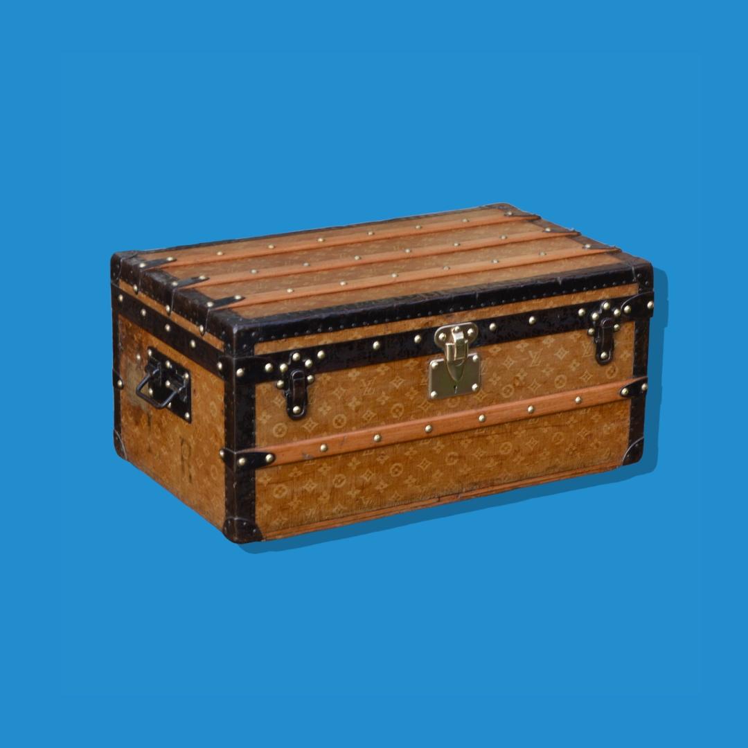 Rare Louis Vuitton small trunk from the end of the 19th century, covered with the jacquard woven fabric - the oldest Monogram covering of Louis Vuitton. This trunk is protected by metal edges, with a brass lock stamped 