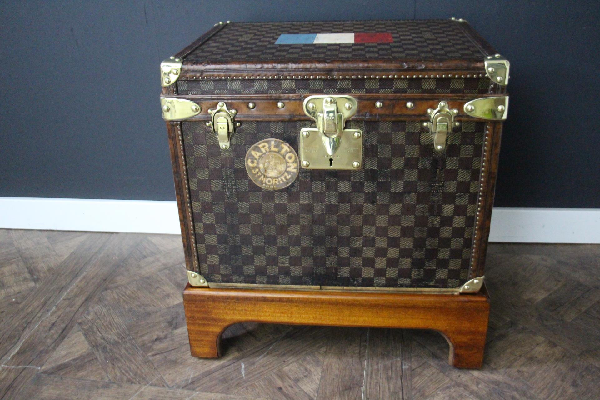 This lovely little Louis Vuitton steamer trunk features the very sought after checkers canvas ,chocolate color leather trim, solid brass corners, locks, and side handles. Its brass locks, studs and side handles are all marked Louis Vuitton.Its brass