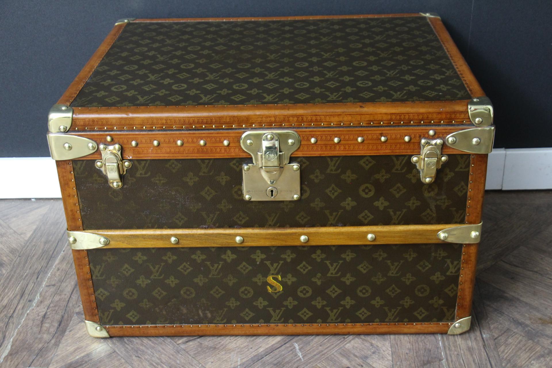 This lovely little Louis Vuitton steamer trunk features stenciled monogram, all honey color lozine trim, solid brass corners, locks, and side handles. Its brass locks and its studs and  are all marked Louis Vuitton.Its side handles have been