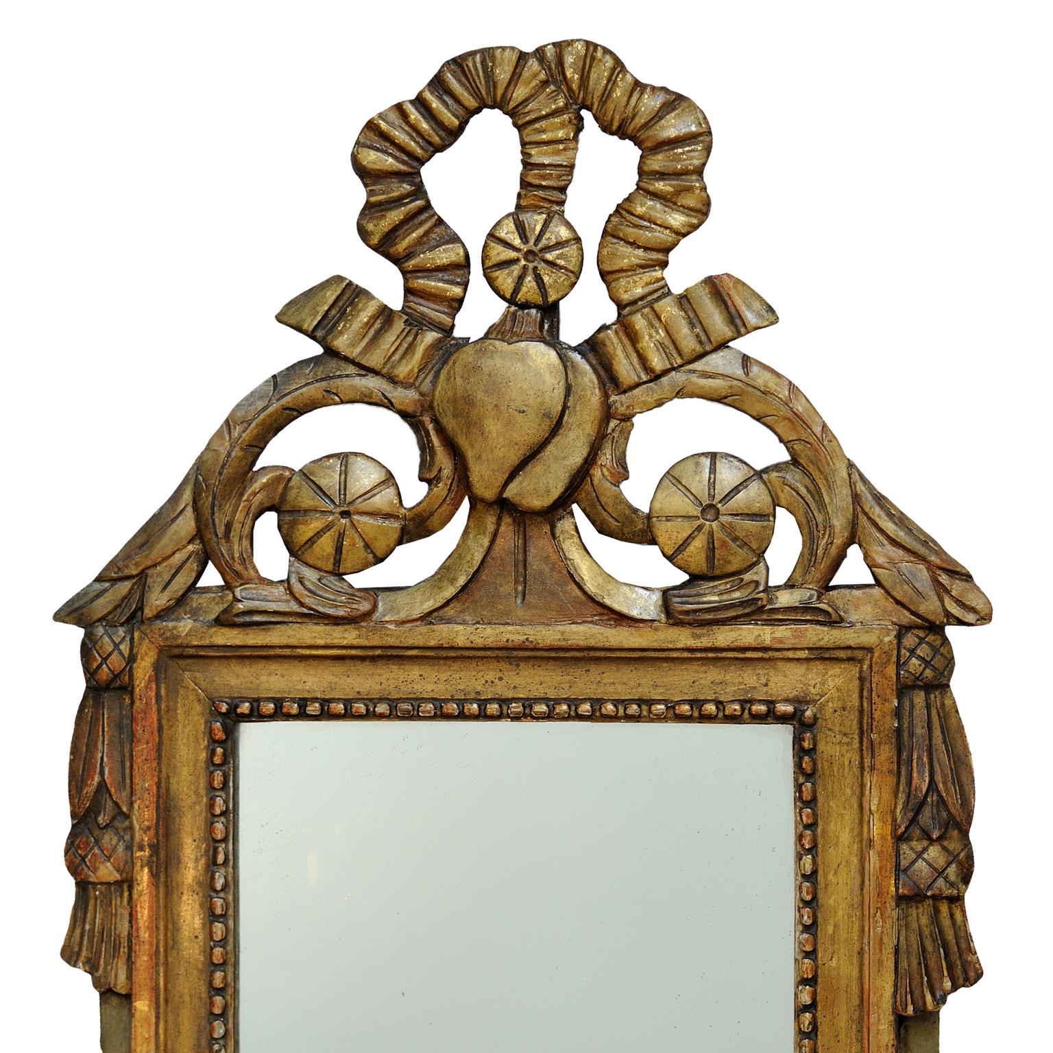 This is a really lovely small late 18th century French Louis XVI period carved giltwood and painted Mirror of great character, retaining its original mirror plate and back boards, circa 1780.