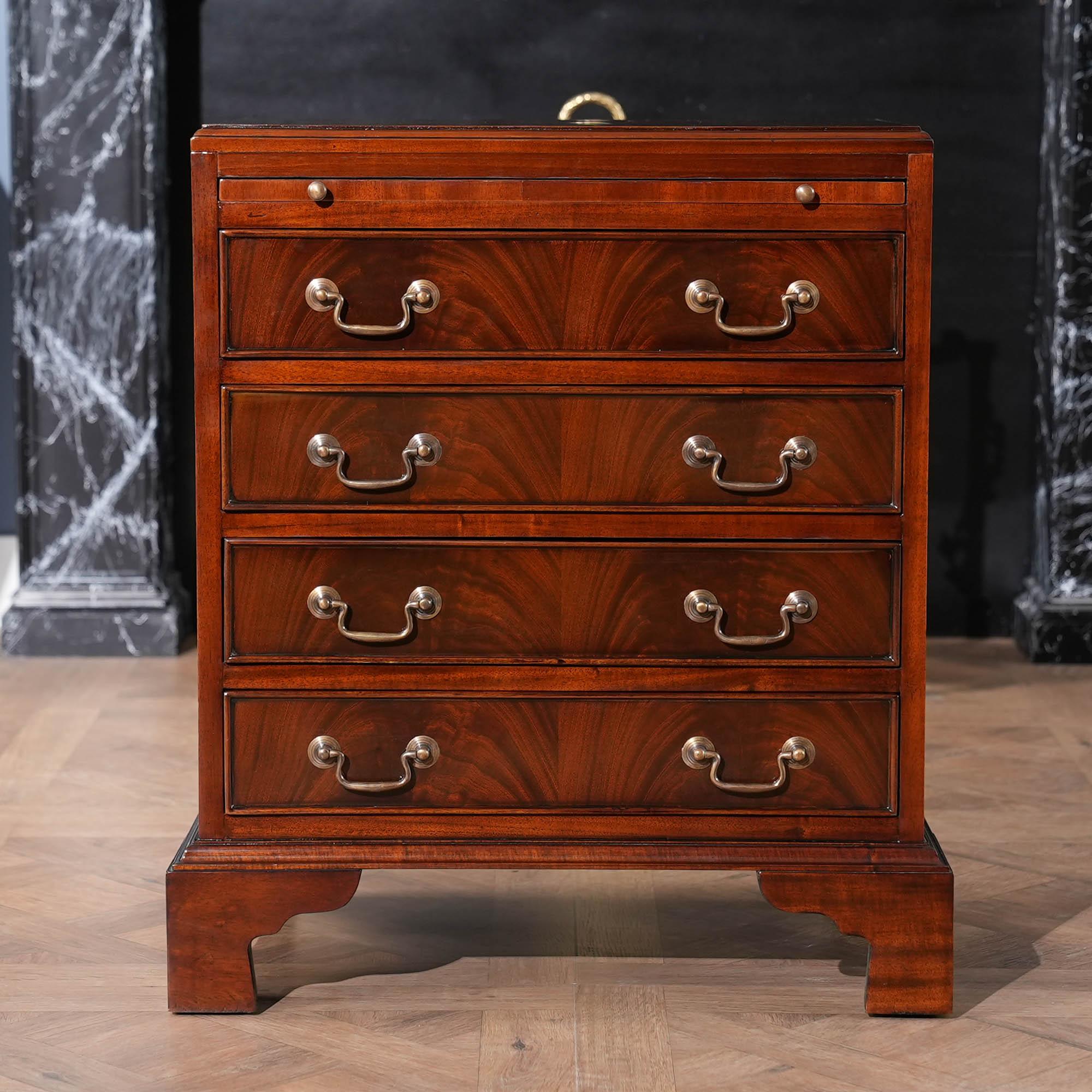 A Small Mahogany Campaign Chest in an English style. This Small Mahogany Campaign Chest works very well as a either a night stand or as an end table. Great quality construction features include the use of the finest mahogany veneers and mahogany