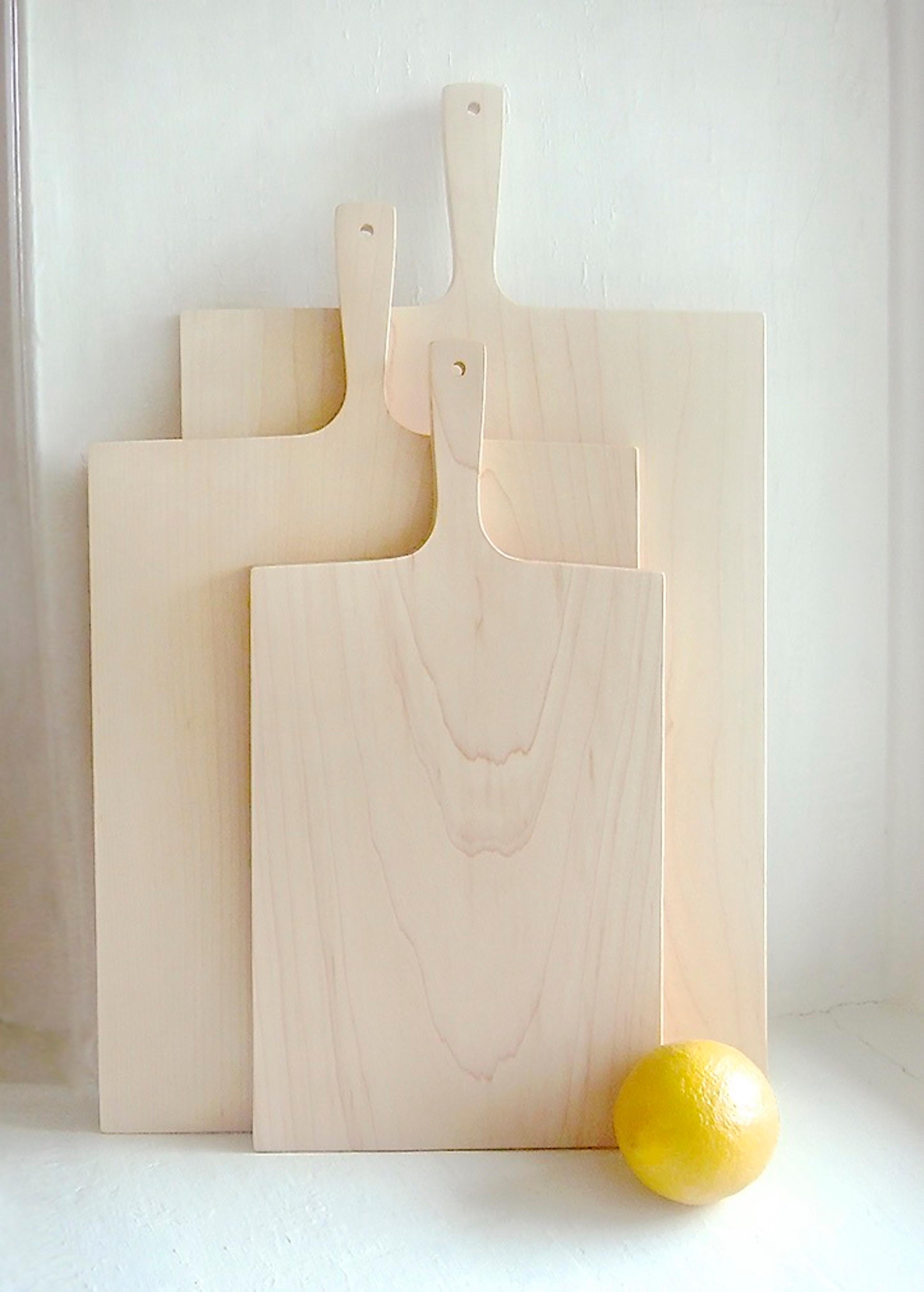 Designed by Deborah Ehrlich and made in Rhode Island by the same master craftsman who makes her chairs - the simplicity and elegance of this maple cutting board speaks to the collector of Deborah Ehrlich's crystal glassware and furniture. 

It's