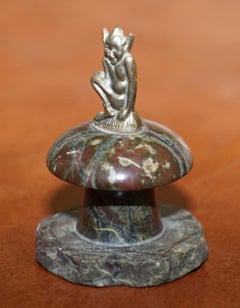 Small Marble Statue with a Little Bronze Pixy Sitting on Top of a Polished Rock