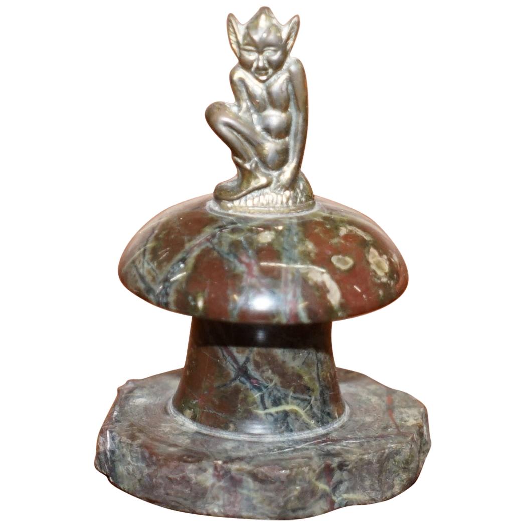 Small Marble Statue with a Little Bronze Pixy Sitting on Top of a Polished Rock