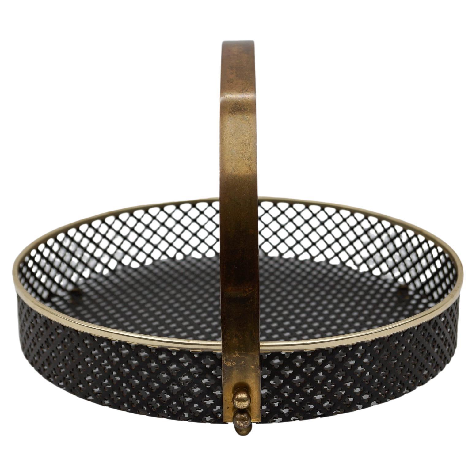 Small Mategot style perforated metal portable serving tray with brass handle For Sale
