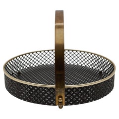 Small Mategot style perforated metal portable serving tray with brass handle