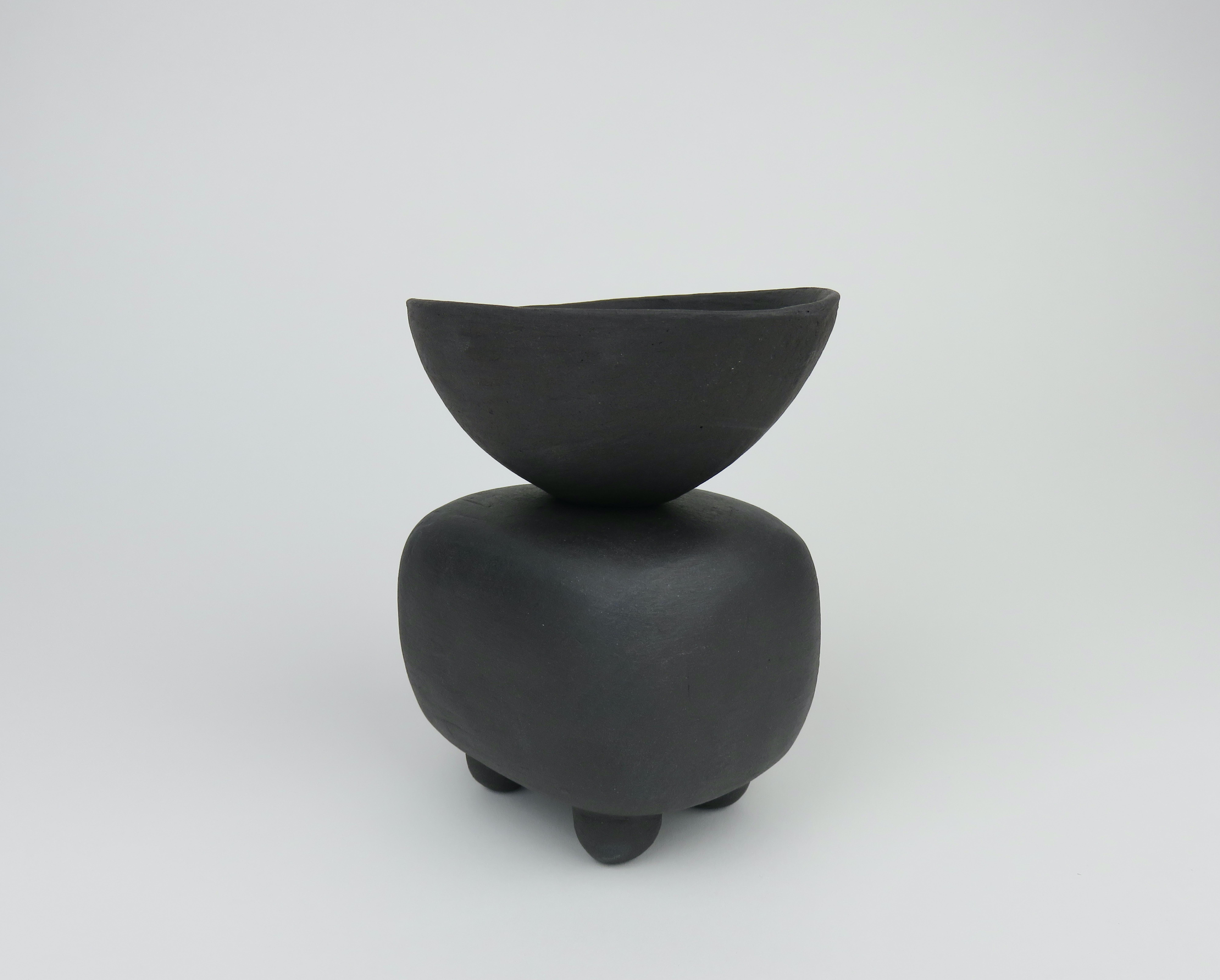 This new series of modern TOTEMS consists of soft round or rectangular forms on small feet. This piece has a rectangular body with a deep, angled bowl on top. The cube shape was formed of a solid piece, hollowed out, then stacked and placed on feet.