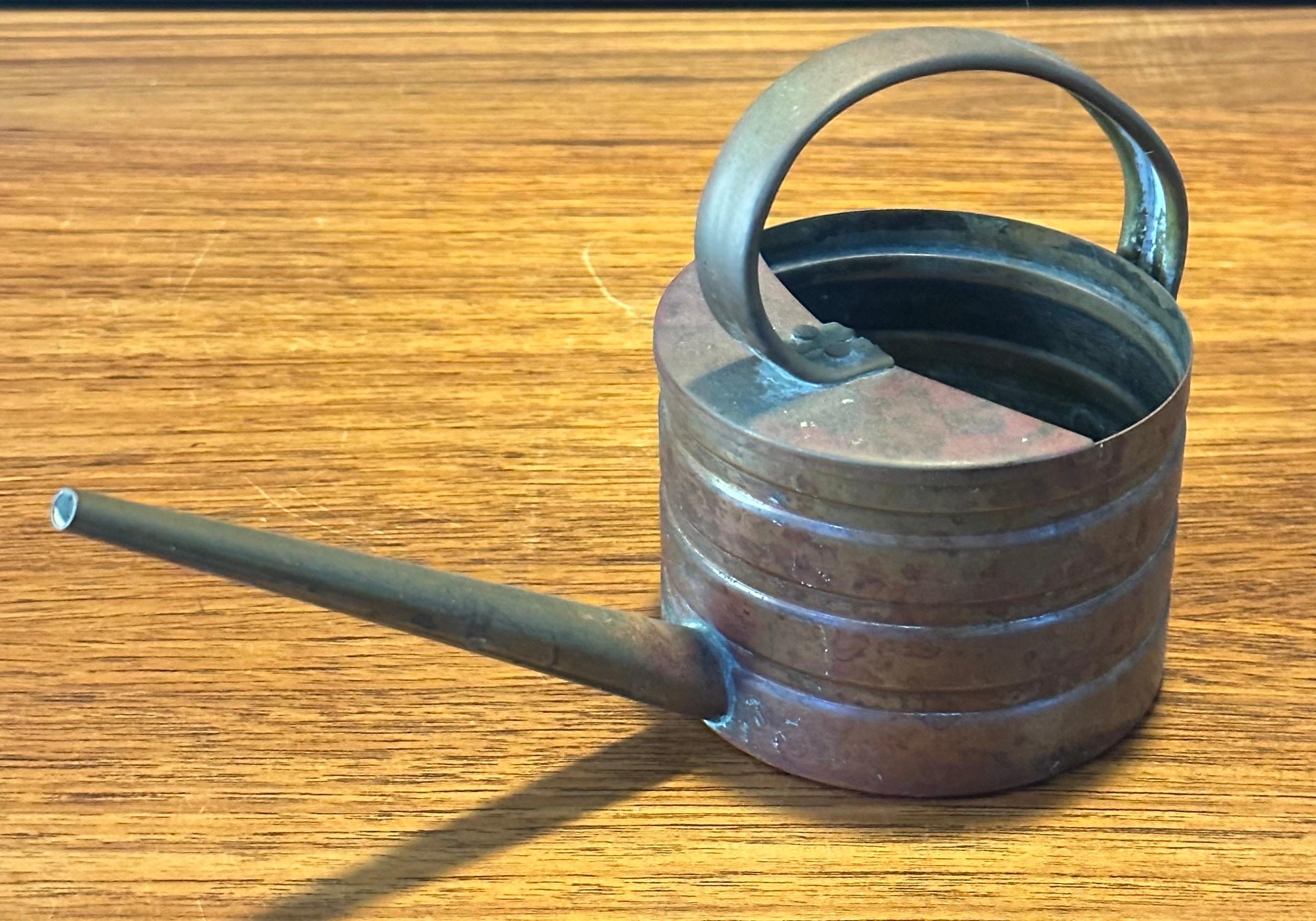 small brass watering can