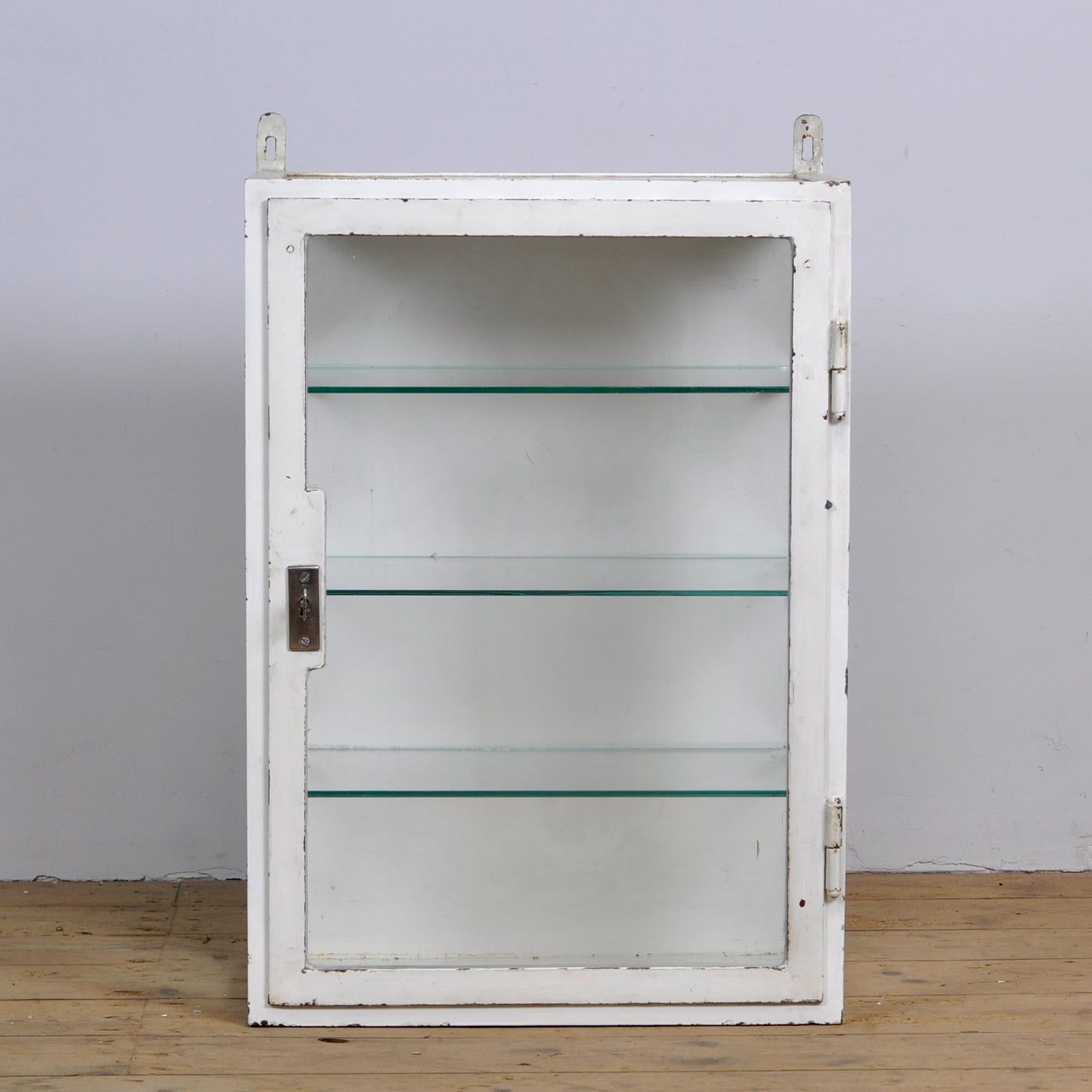 Medical cabinet from the 1930s. The cabinet (wall unit) was produced in Hungary and is made of thick iron and glass. From a hospital in Budapest.