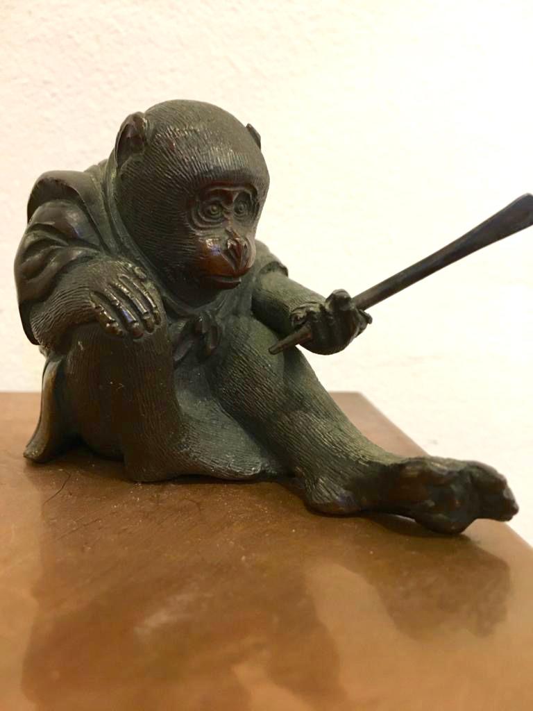 A small and interesting okimono bronze figure of a monkey wearing a kimono. Unsigned but a well-executed and delightfully detailed piece. Pretty flower and petal detail on the arms and back of the kimono with both lower lapels being gilded. Weight