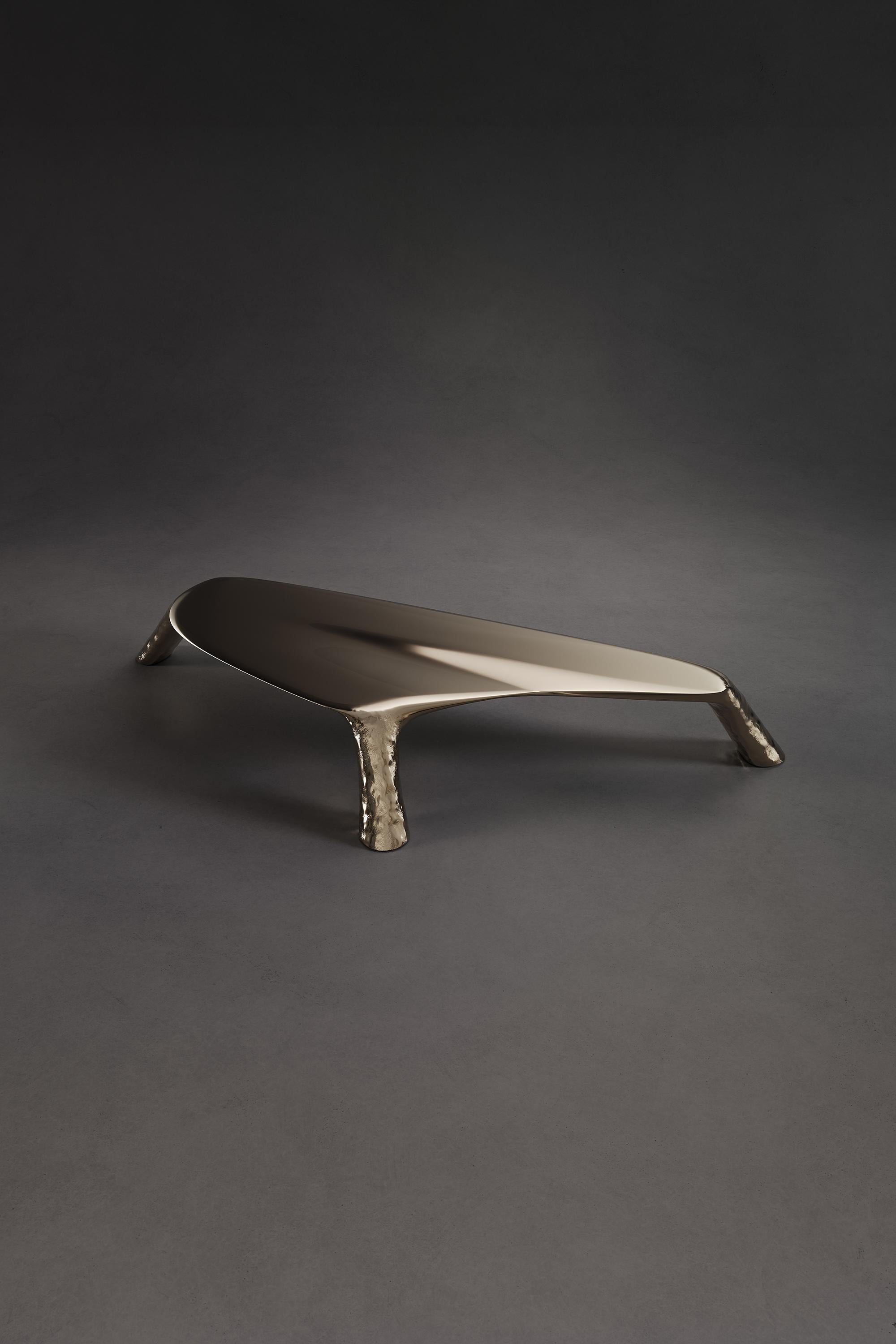 Small Merging Table by Atelier V&F
Limited Edition Of 12+2AP Pieces.
Dimensions: D 67.5 x W 153 x H 21 cm. 
Materials: Cast brass.

「Merging Tables」, a set of two coffee tables, taking its shape from the unsteady posture of newborn calves, picture