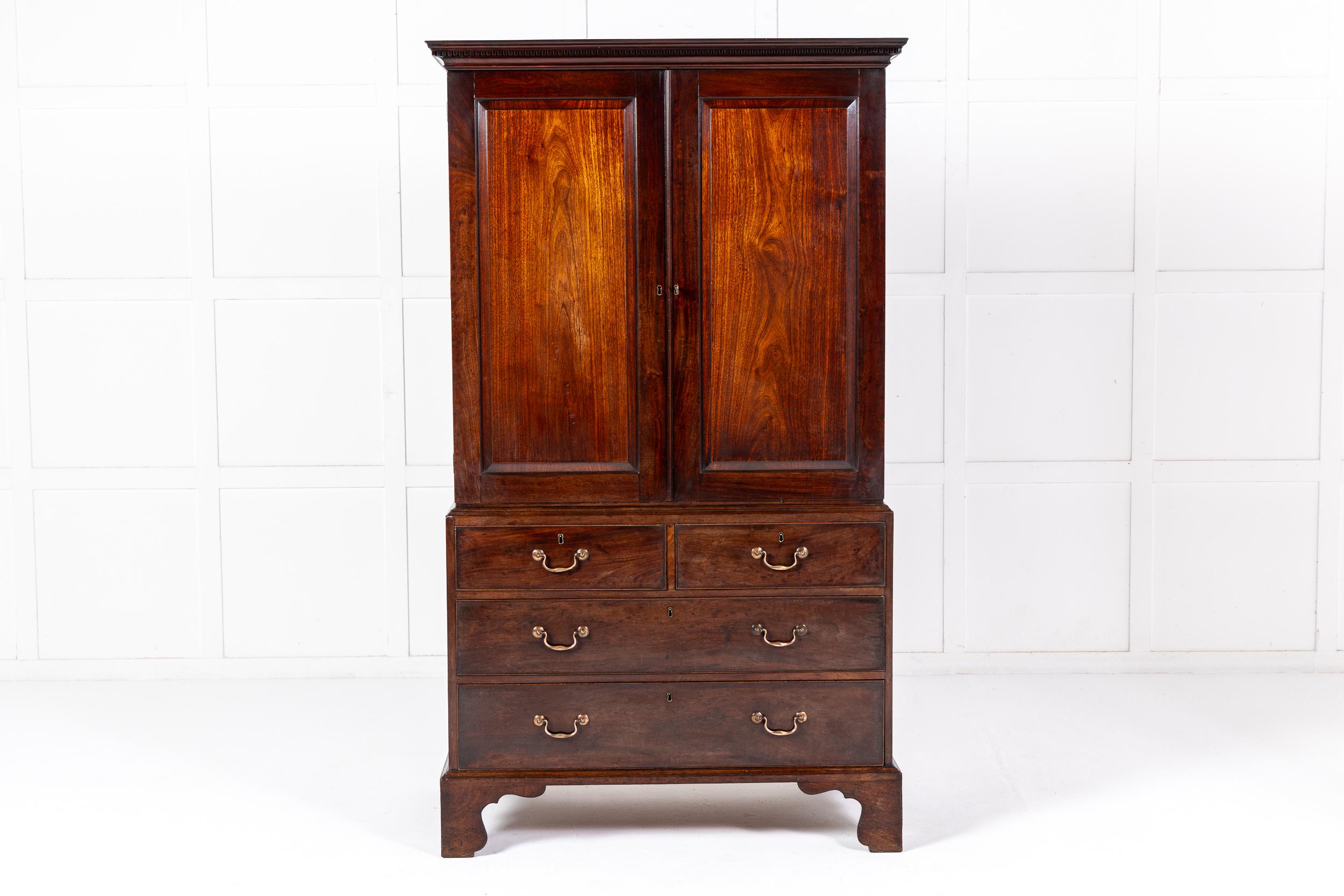 A Very Fine Mid 18th Century English Mahogany Linen Press of Desirable Small Size.

Of extremely fine proportions, this beautiful linen press or wardrobe is of unusually small and desirable size but with the depth one would expect from any piece of