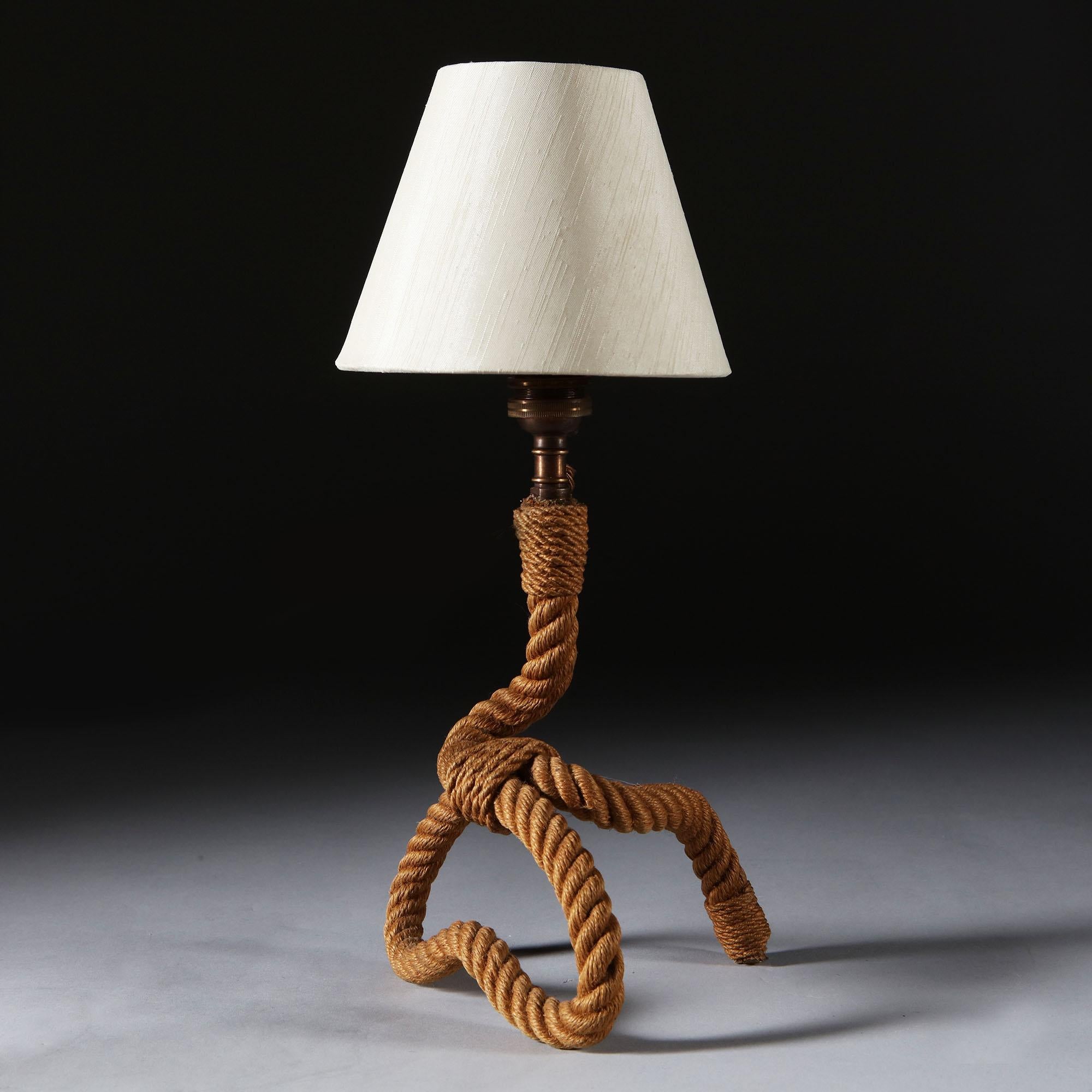 A mid-20th century French sculptural desk lamp in the form of a twisted rope, attributed to Adrien Audoux and Frida Minet. With custom shade.

Designers Adrien Audoux and Frida Minet were working together in mid-20th century France, designing and
