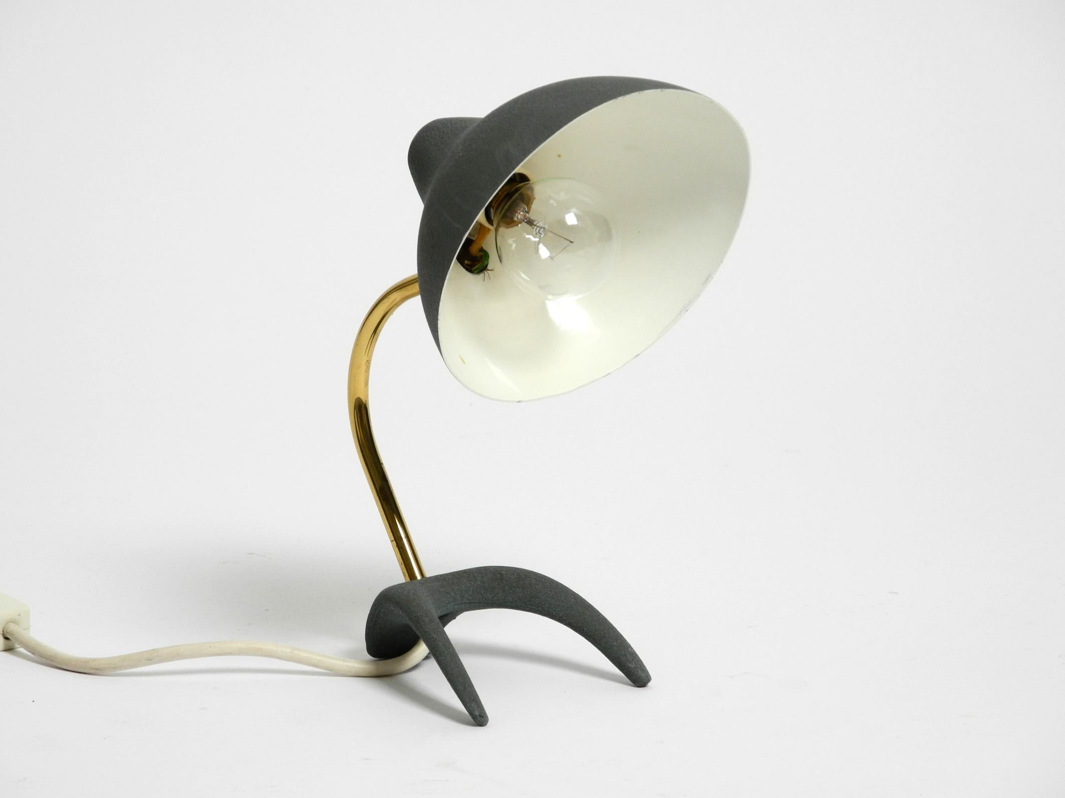 German Small Mid Century crow's foot table lamp by Louis Kalff in very good condition For Sale