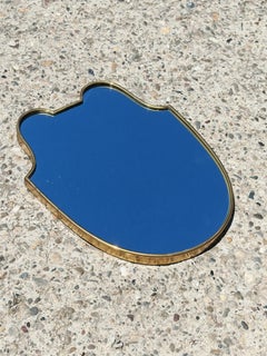 Small Mid Century Modern Shield-shaped Mirror in Brass frame, Italy 1950s