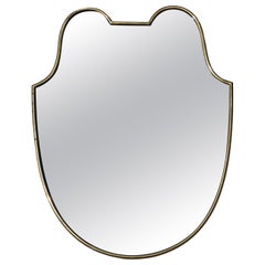 Small Mid Century Modern Shield-shaped Mirror in Brass frame, Italy 1950s