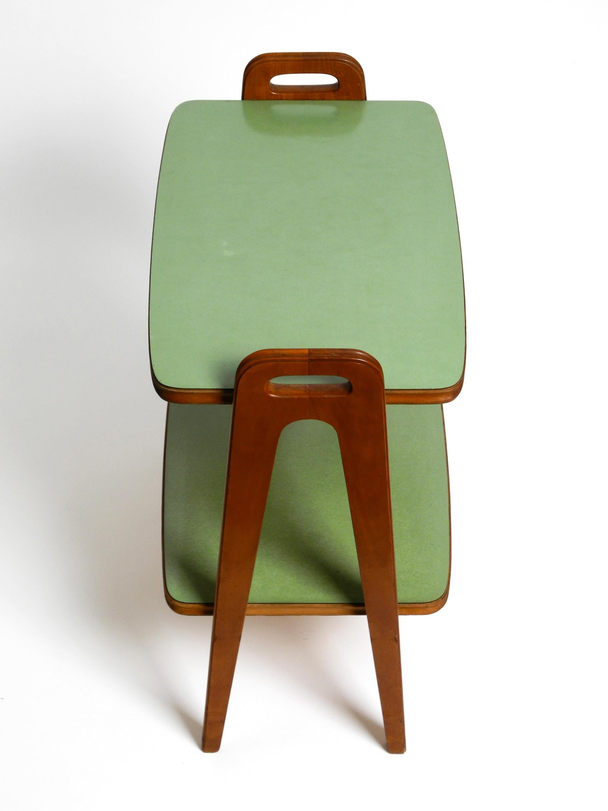 Small Mid Century Modern side table made of walnut with green Formica surfaces 9
