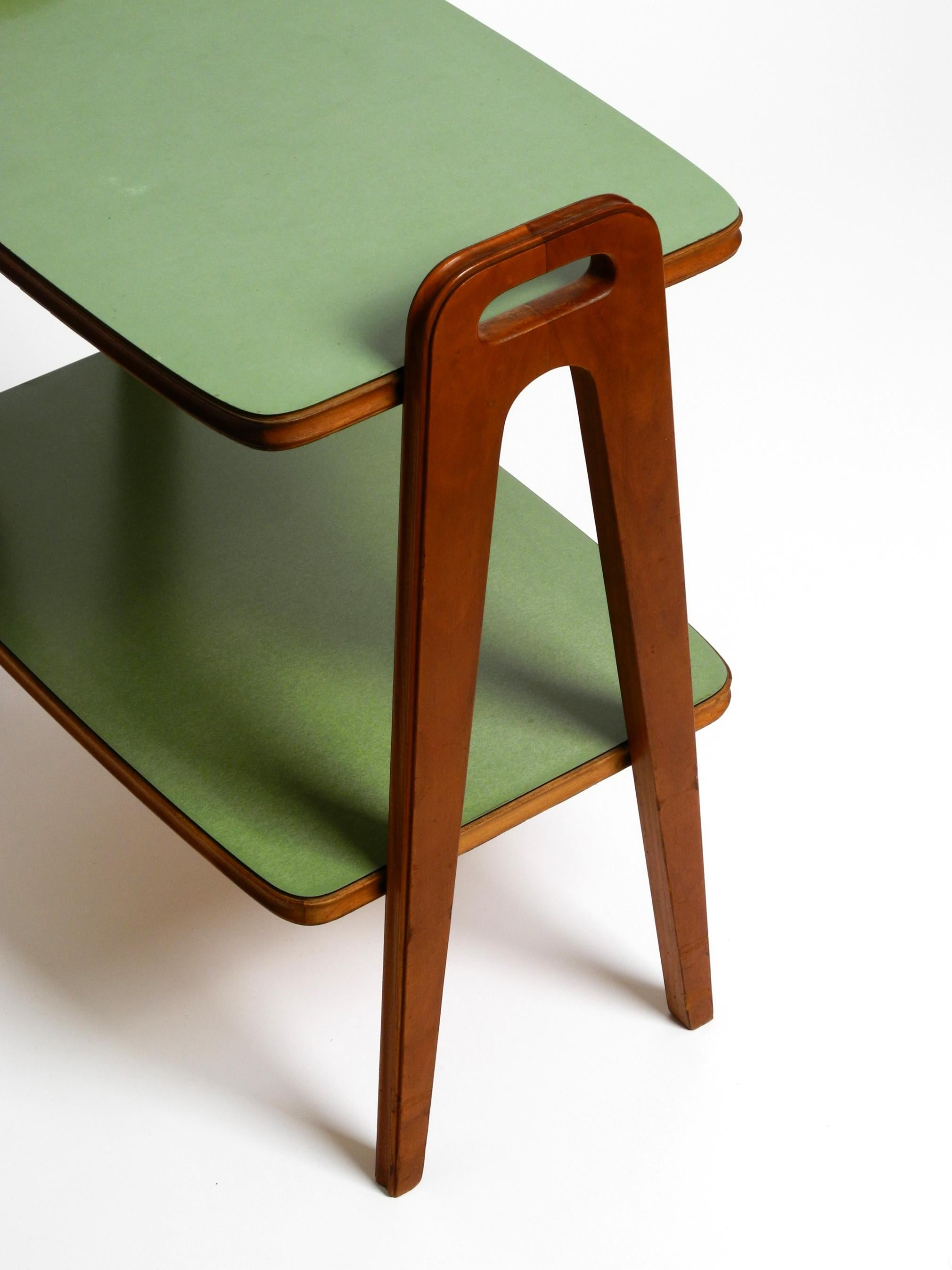Mid-20th Century Small Mid Century Modern side table made of walnut with green Formica surfaces