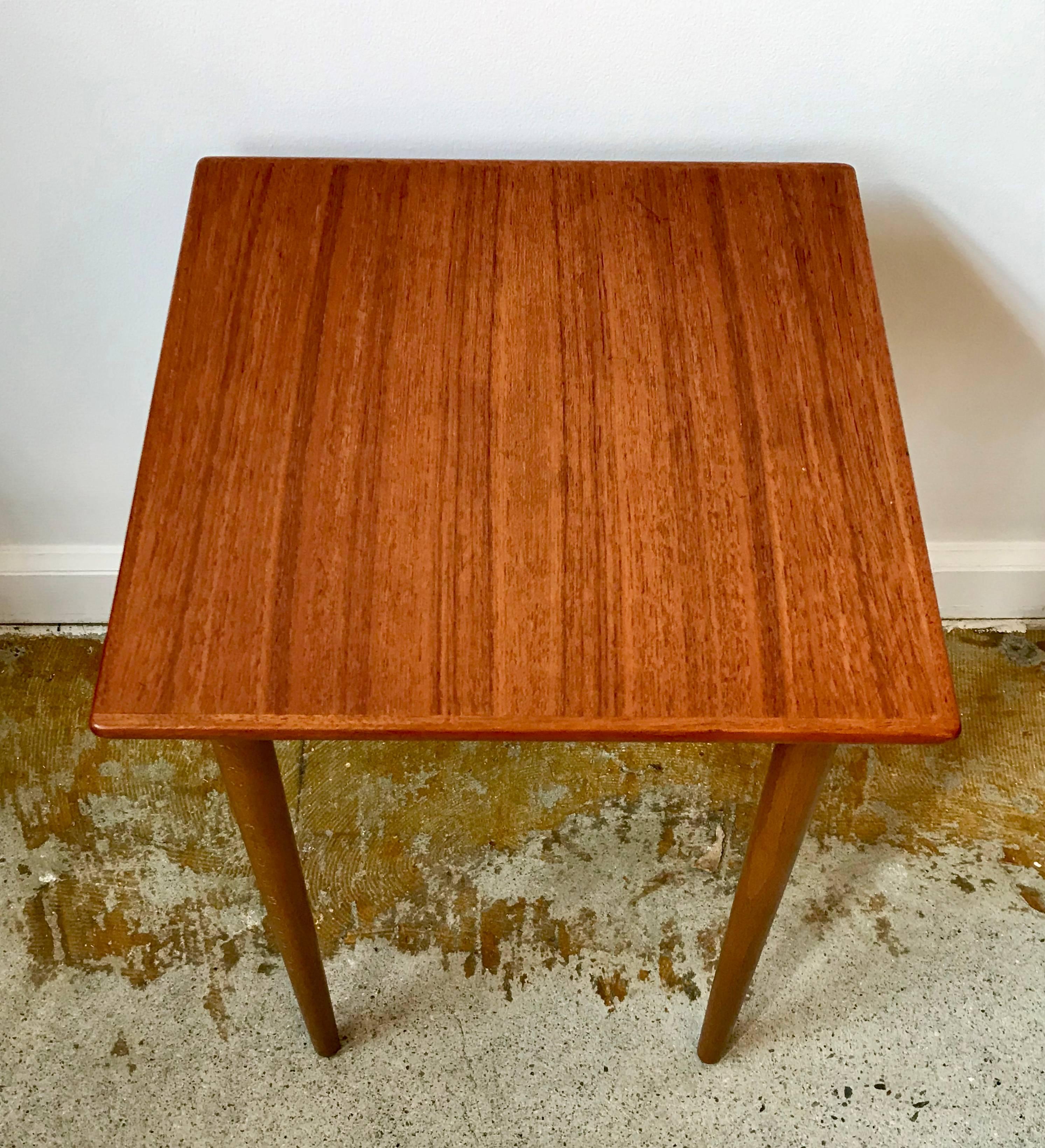 Very cute petite tapered leg side table made of teak, nice mitered edges, 1960s Danish.