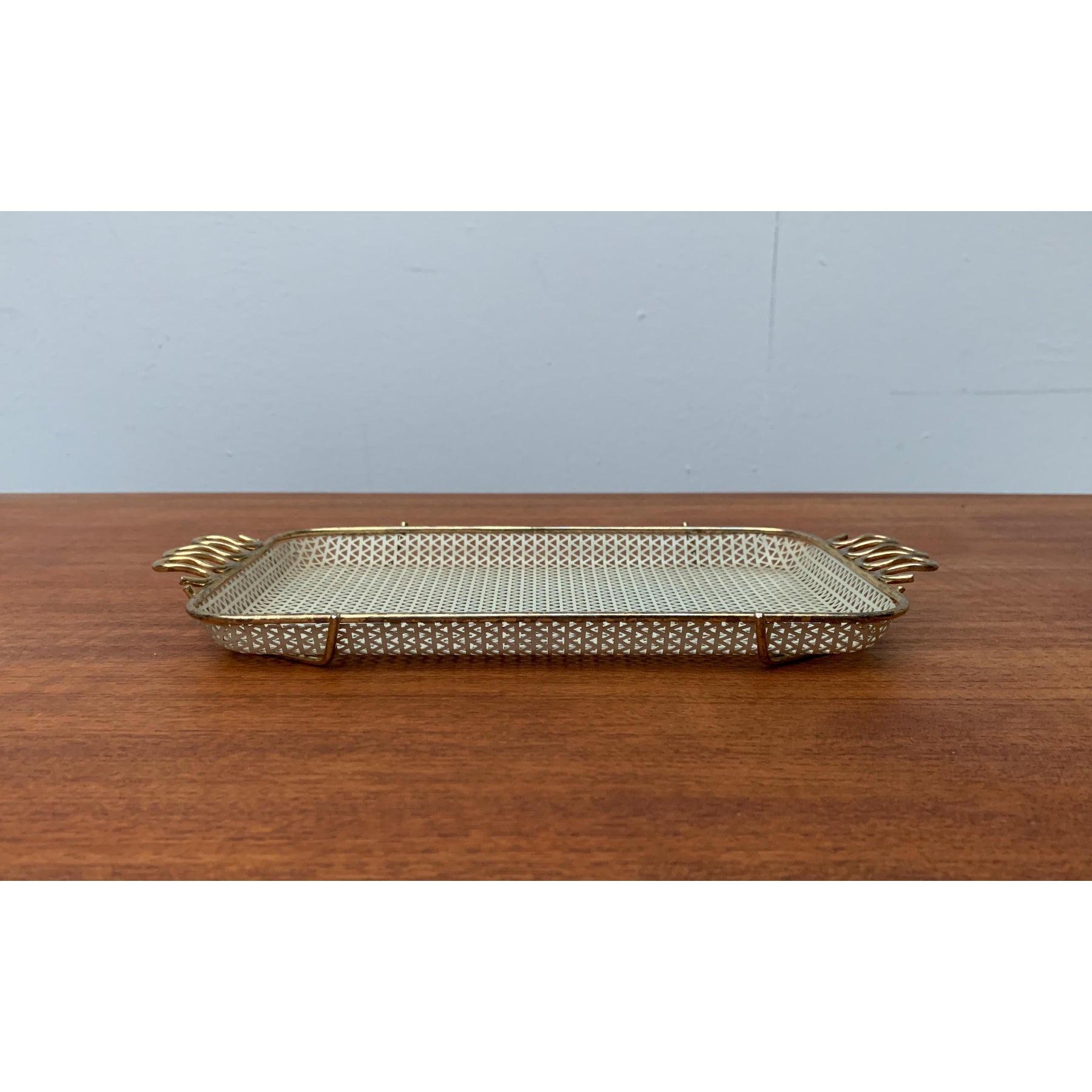 Small Mid-Century Perforated Tablet, in Very Good conditions. Designed 1950 to 1959.

Additional information:
Materials: Metal
Color: Cream
Styles: Mid-Century Modern
Period: 1950s
Item Type: Vintage, Antique or Pre-owned
Dimensions: 11.02ʺW ×