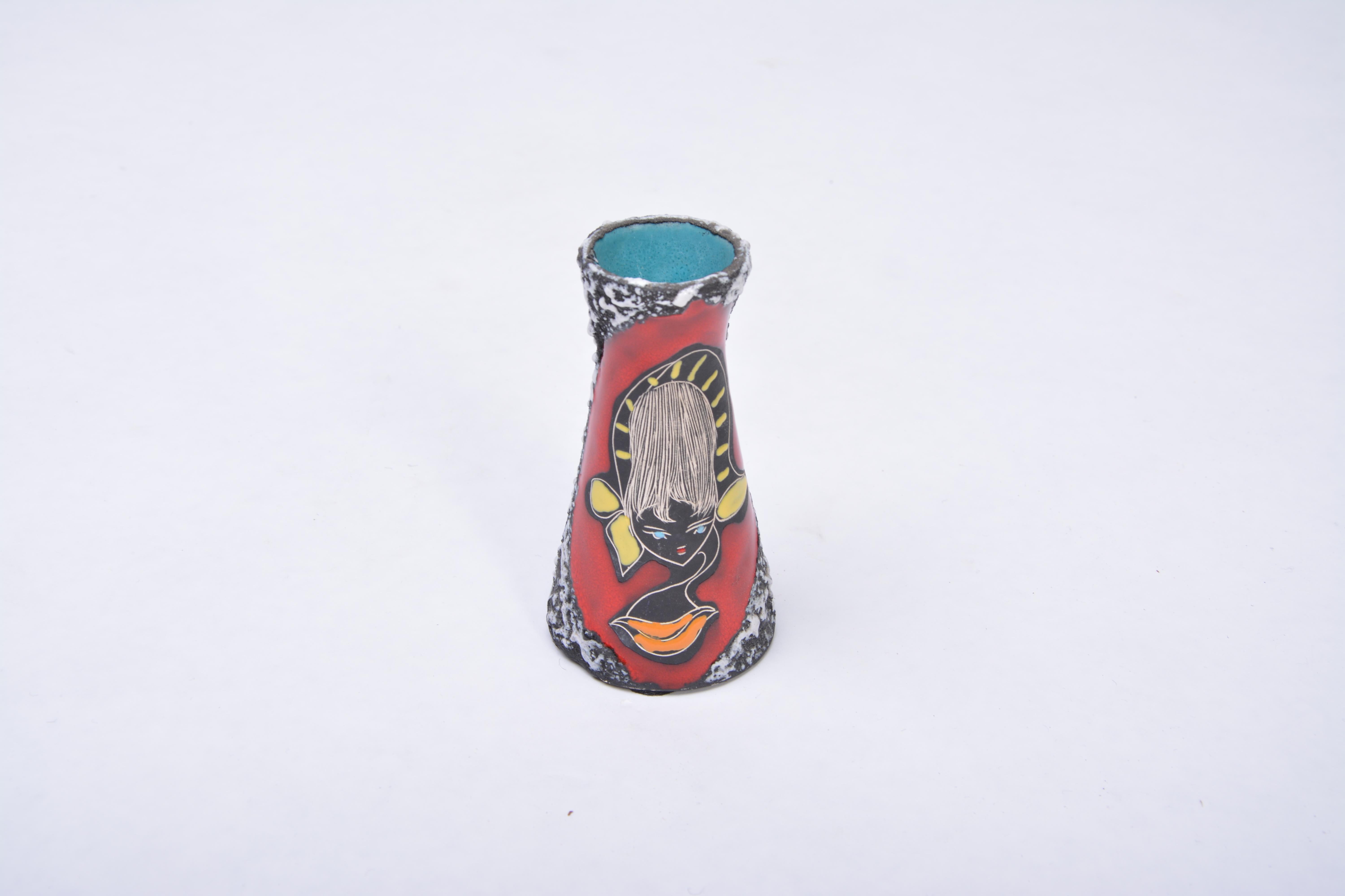Small Multi-Coloured Midcentury San-Marino Fat Lava Vase
A small Italian midcentury ceramic vase, made in San Marino. This stunning little vase is decorated with a sgraffito ladies head and beautifully colored enameled glossy glazes. The vase is