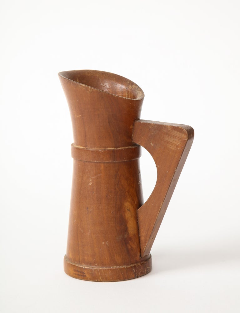 Small Mid-Century Vintage Wooden Pitcher, France, c. 1950s. 

Elegant in composition yet rustic in finish, this pitcher makes for a delightful decorative object.
