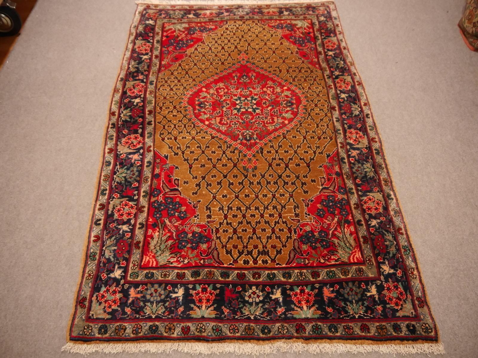 Semi antique Kurdi rug of great quality and color. This dramatic colored piece has its untouched original condition with high pile and original fringes and selvedge. Camel, vibrant red and dark blue.