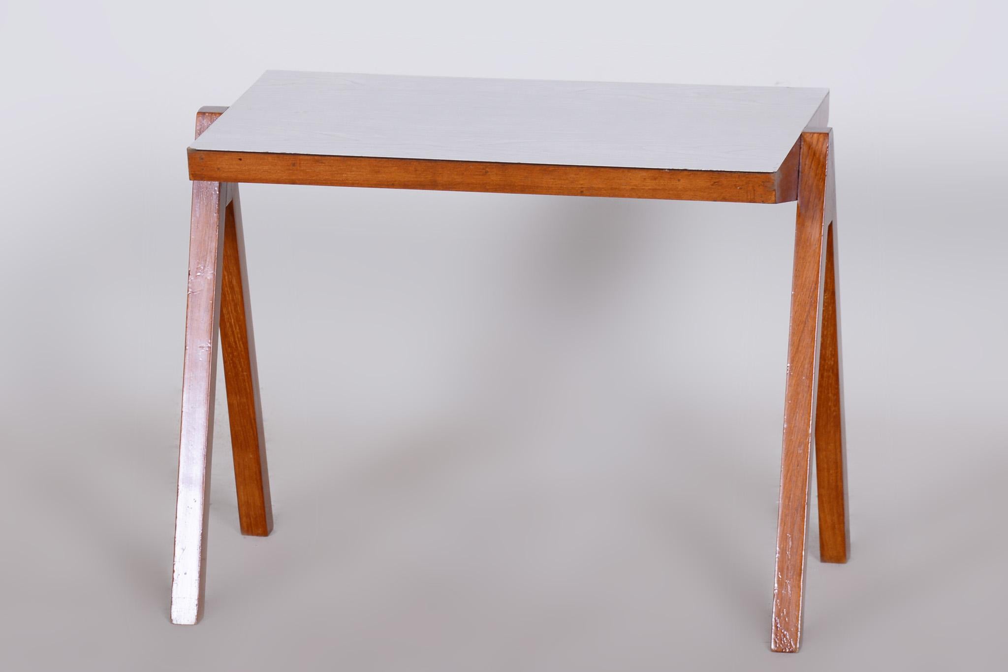 Small midcentury table.

Source: Czechia
Period: 1950-1959
Material: Beech and Umakart

Stable construction.
Refreshed polish.