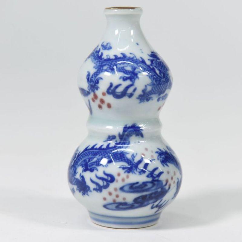 Small Miniature Blue and White Chinese vase

Additional information:
Material: Bronze
Style: 1900 early 20th century
Dimension: 8 W x 8 D x 24 H cm.