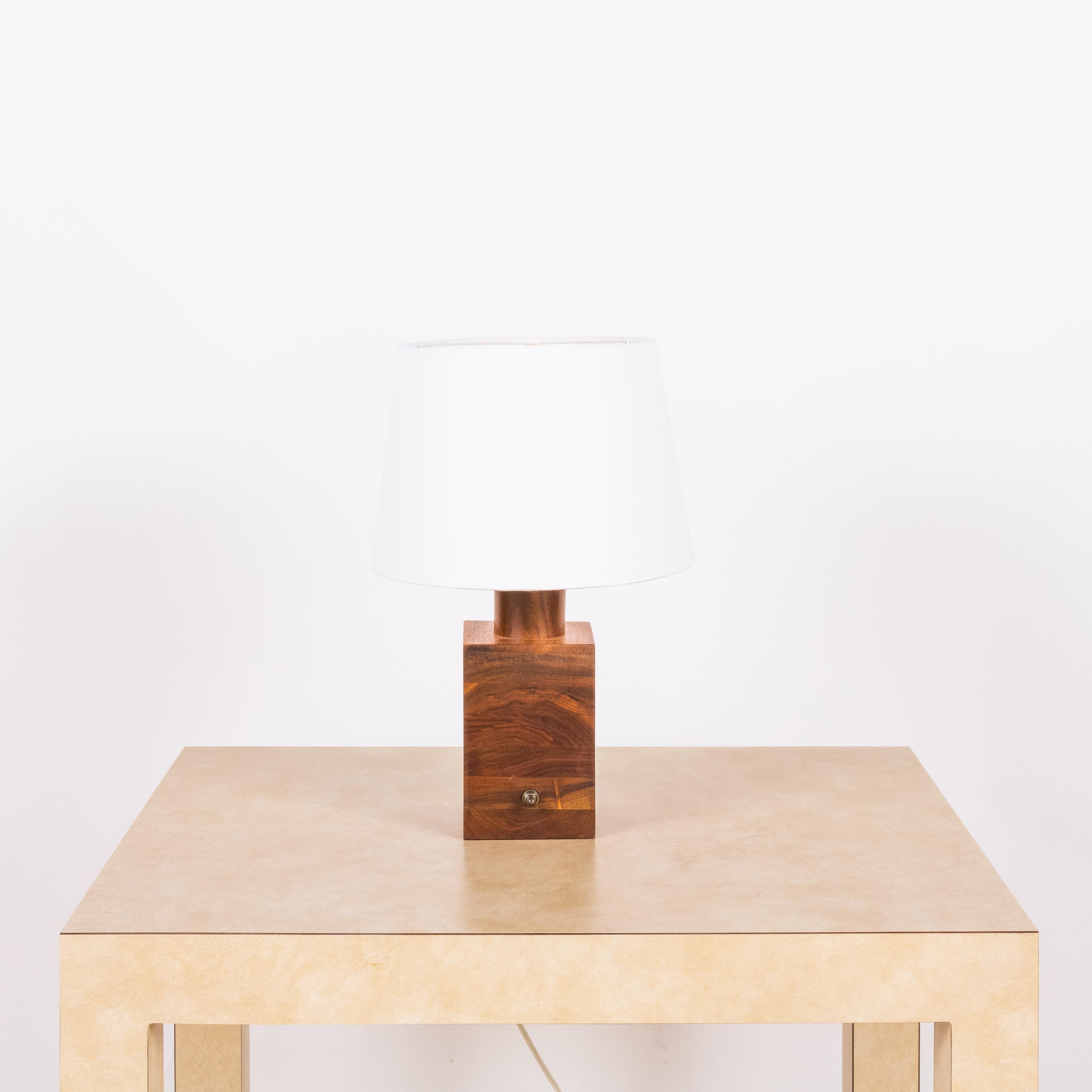 Small minimalist teak lamp with parchment paper shade.

Great as a desk lamp or where a small lamp is needed.

Dimensions listed (10 in. diameter x 16 in. tall) are the overall dimensions of the lamp with the shade) with the teak lamp base 9 1/2