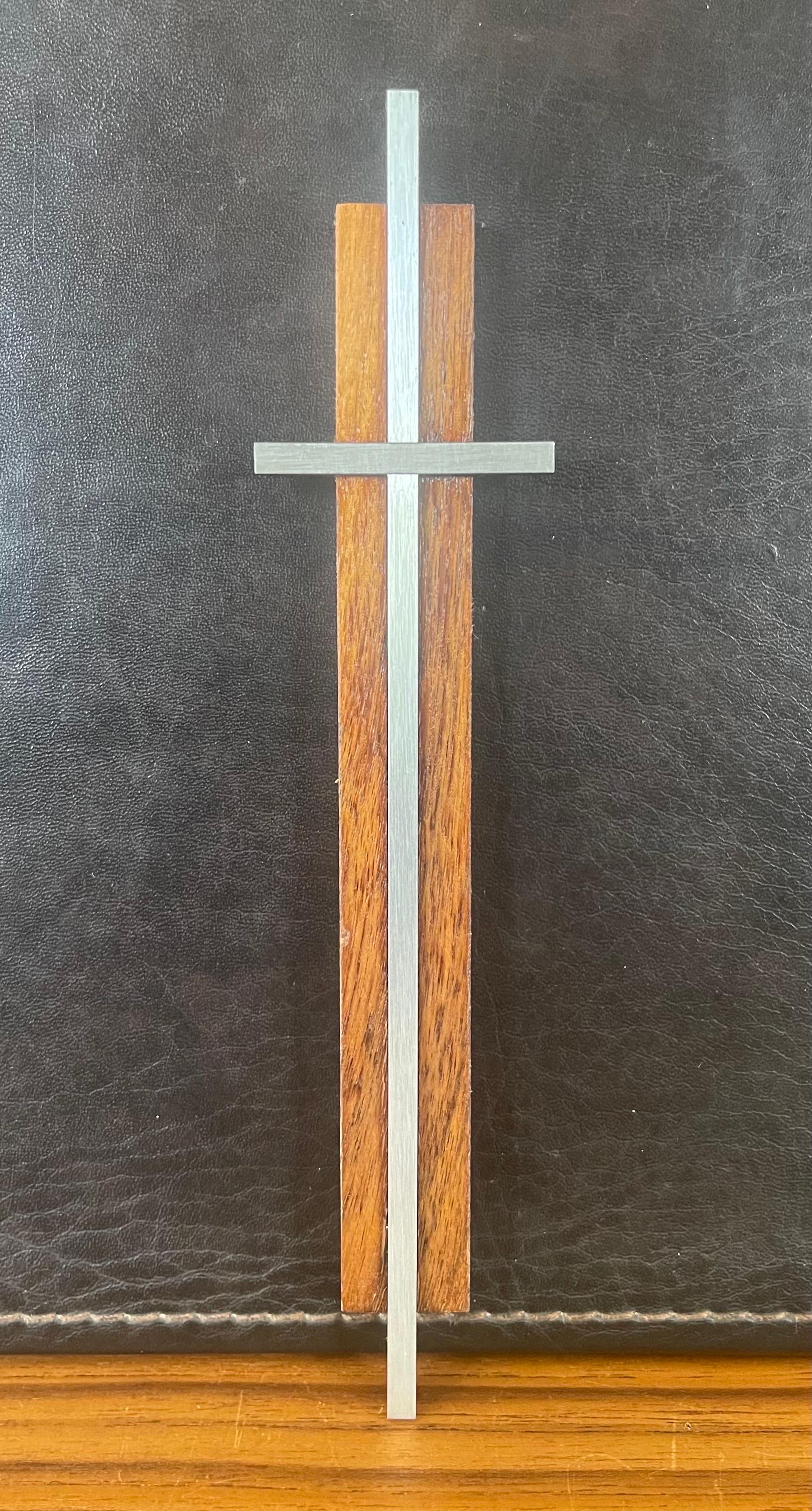 Small minimalist walnut and aluminum crucifix / cross, circa 1960s. The piece measures 8.5